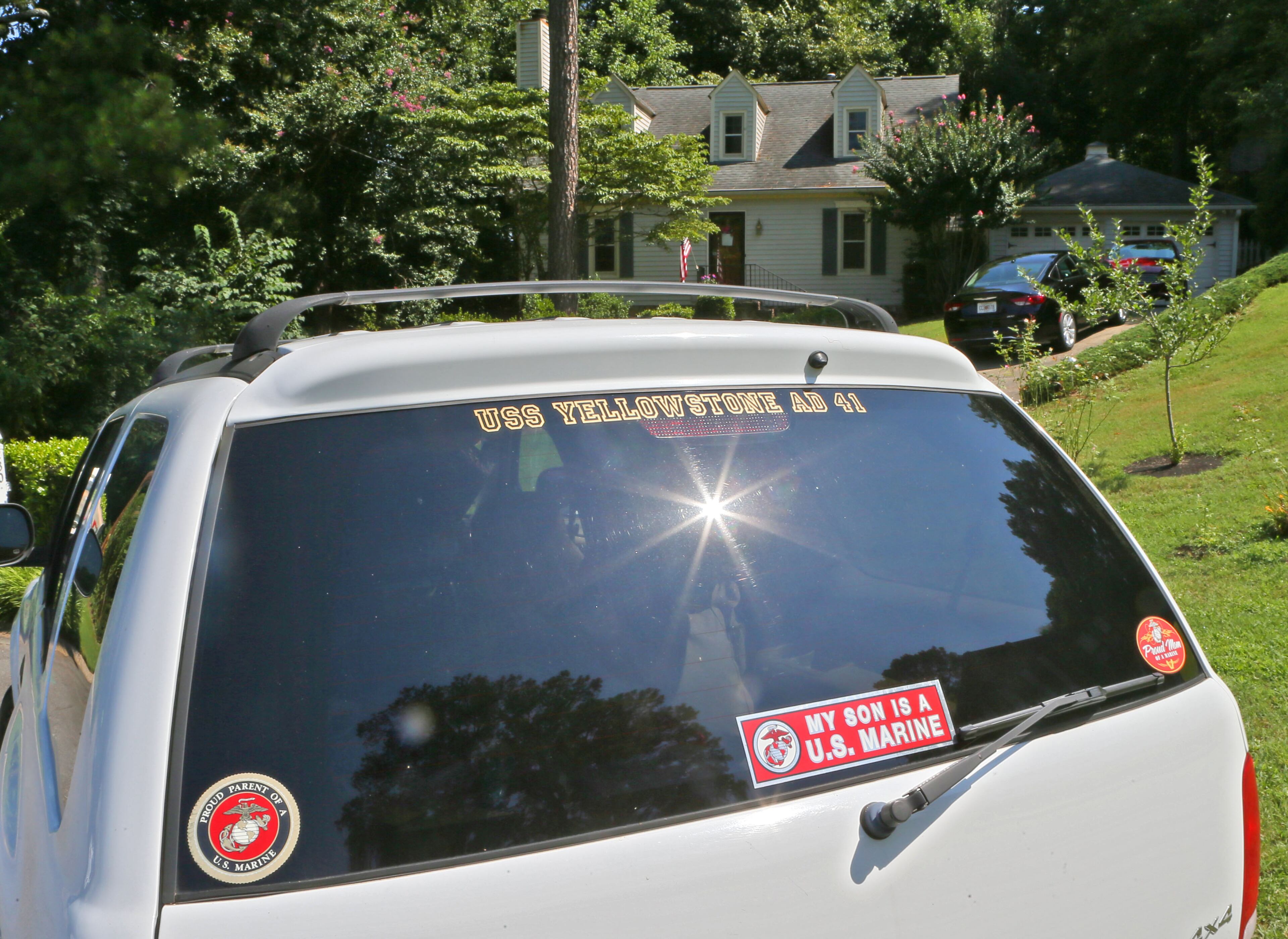 The vehicle parked in front of the Wells residence had stickers saying "Proud Mom of a Marine" and "My son is a U.S. Marine" and a U.S. flag hung from a pole on the front porch. Sprayberry High graduate and ROTC student Skip Wells was was one of the Marines killed in the Chattanooga shooting yesterday. A steady stream of visitors stopped by his mother's house this morning. Family friend Andy Kingery said Wells' grieving mother and other family members did not want to talk to the the media Friday morning. BOB ANDRES / BANDRES@AJC.COM