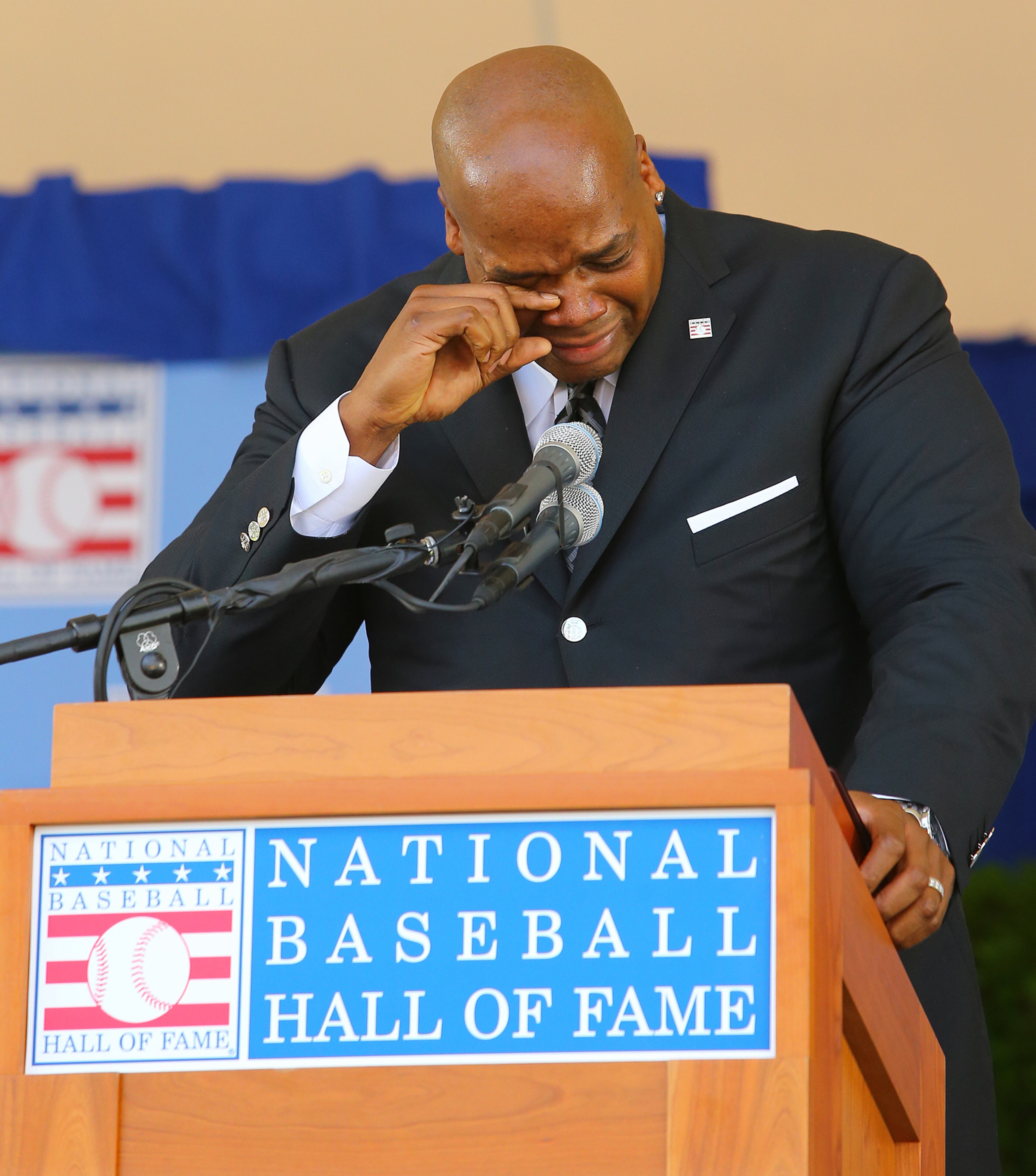 Frank Thomas wipes away tears as he is overcome by emotion during his speech at the National Baseball Hall of Fame Induction Ceremony at Clark Sports Center on Sunday, July 27, 2014, in Cooperstown. CURTIS COMPTON / CCOMPTON@AJC.COM