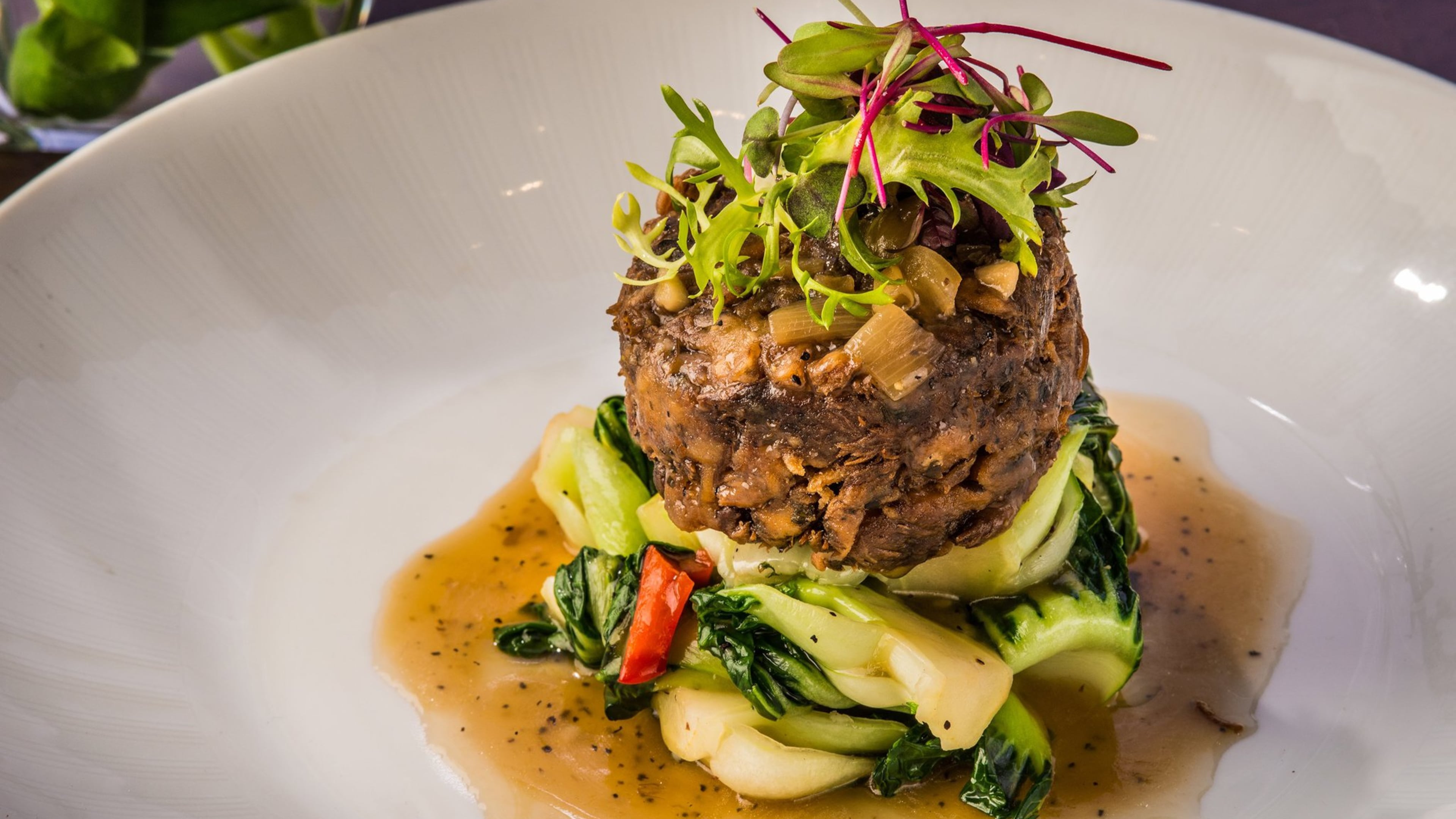 A pom pom mushroom in a peppery sauce is a ringer for fillet mignon. (Phillip Vullo)