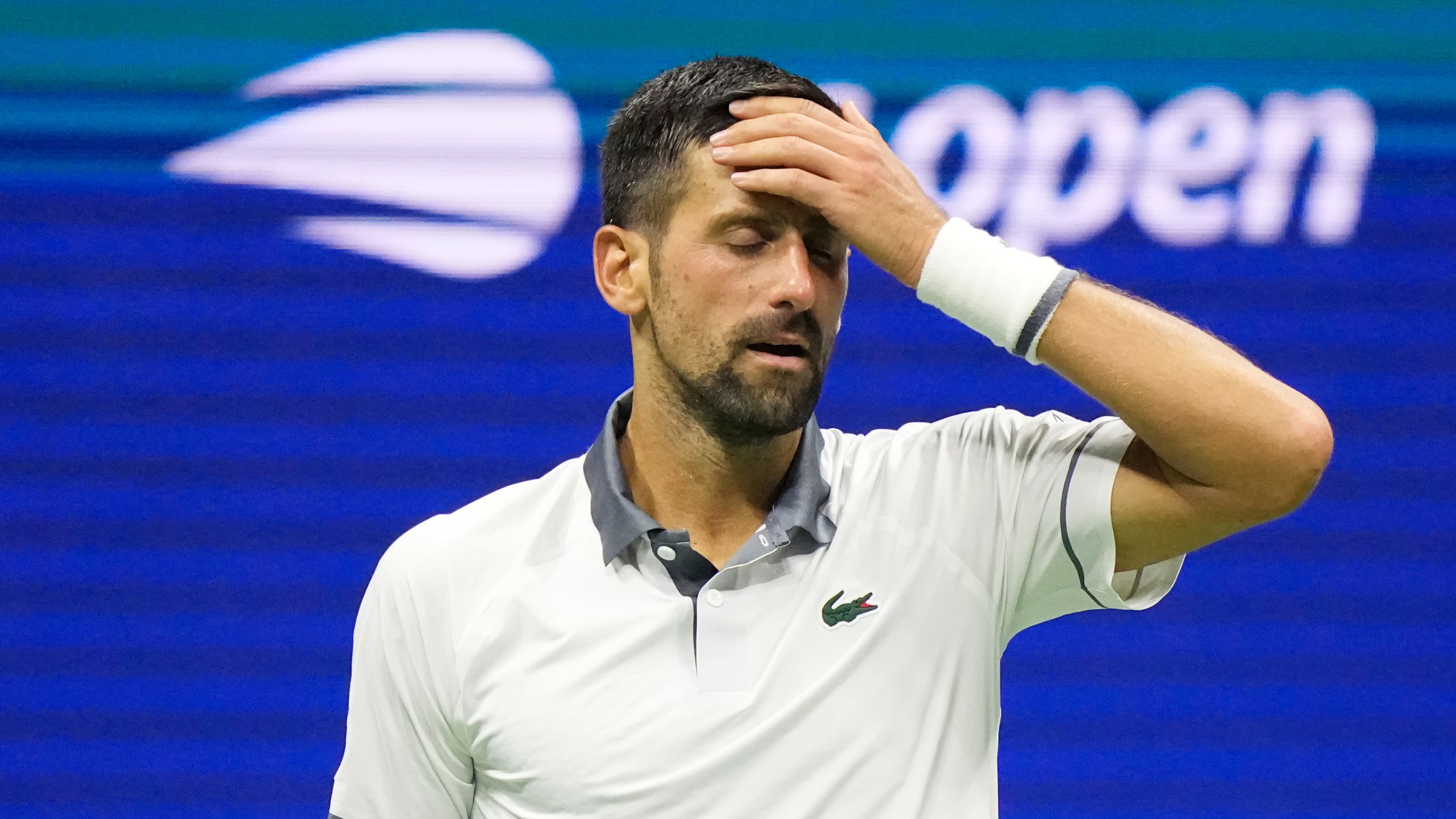 Novak Djokovic, of Serbia, reacts during the first round of the U.S. Open tennis championships against Mariano Navone, of Argentina, Sunday, Aug. 30, 2026, in New York. (AP Photo/Frank Franklin II)