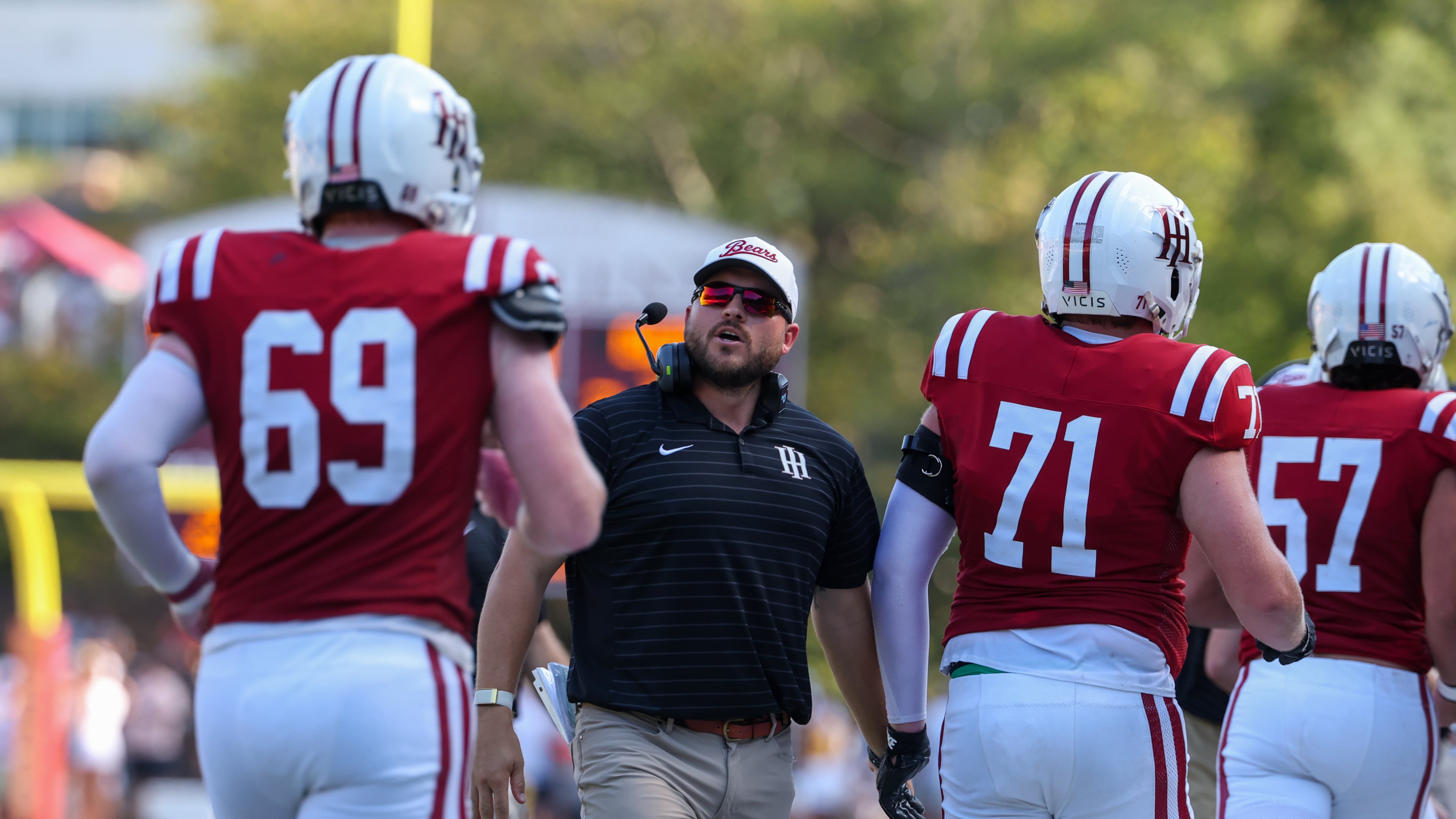 Holy Innocents' head coach Nick Perrotta addresses players during the first half of their game against Mount Vernon on Sept. 4, 2026. (Arvin Temkar/AJC)