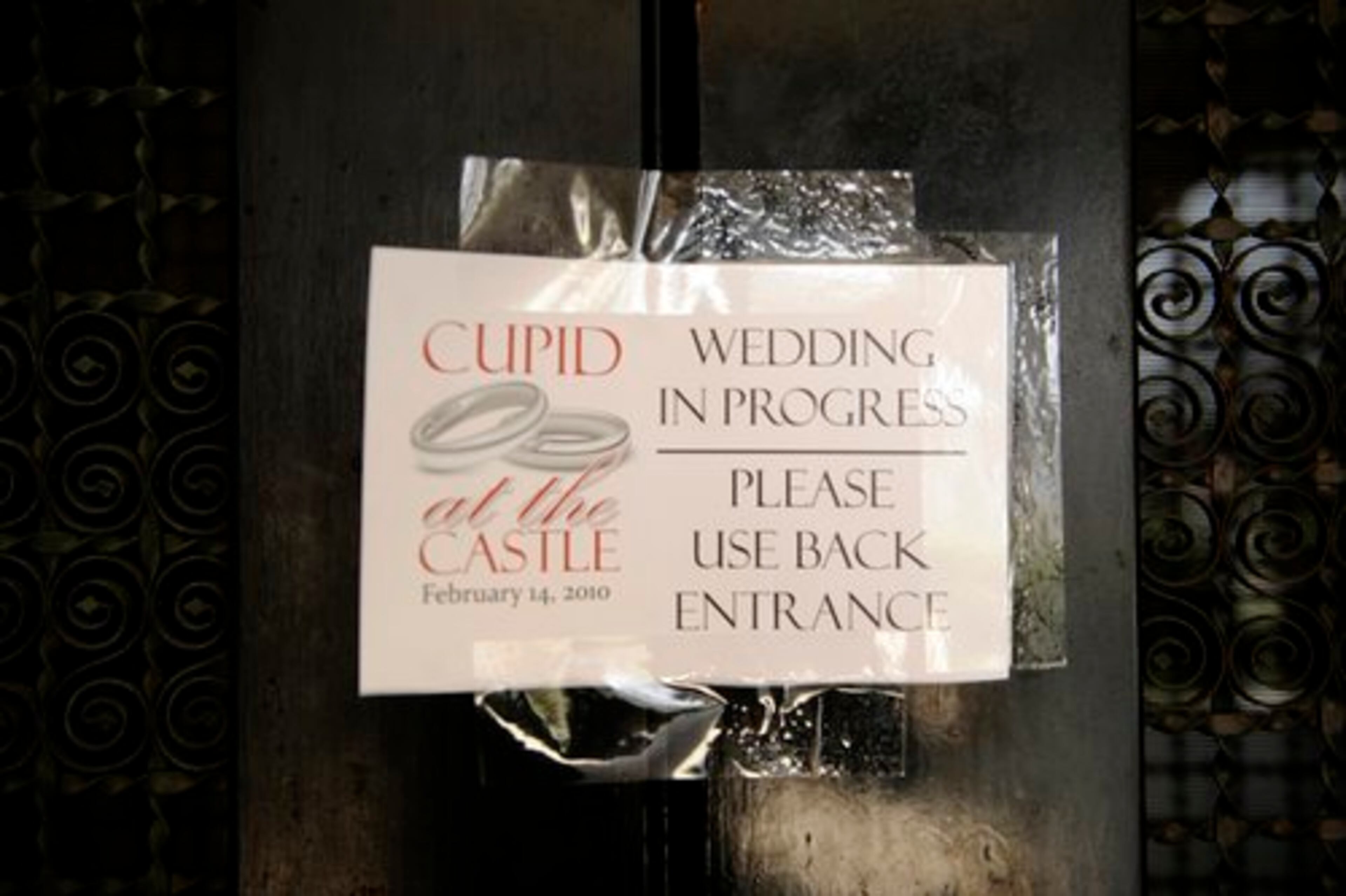 A sign posted on the front doors to Rhodes Hall on Valentine's Day only partially indicates what is going on inside.