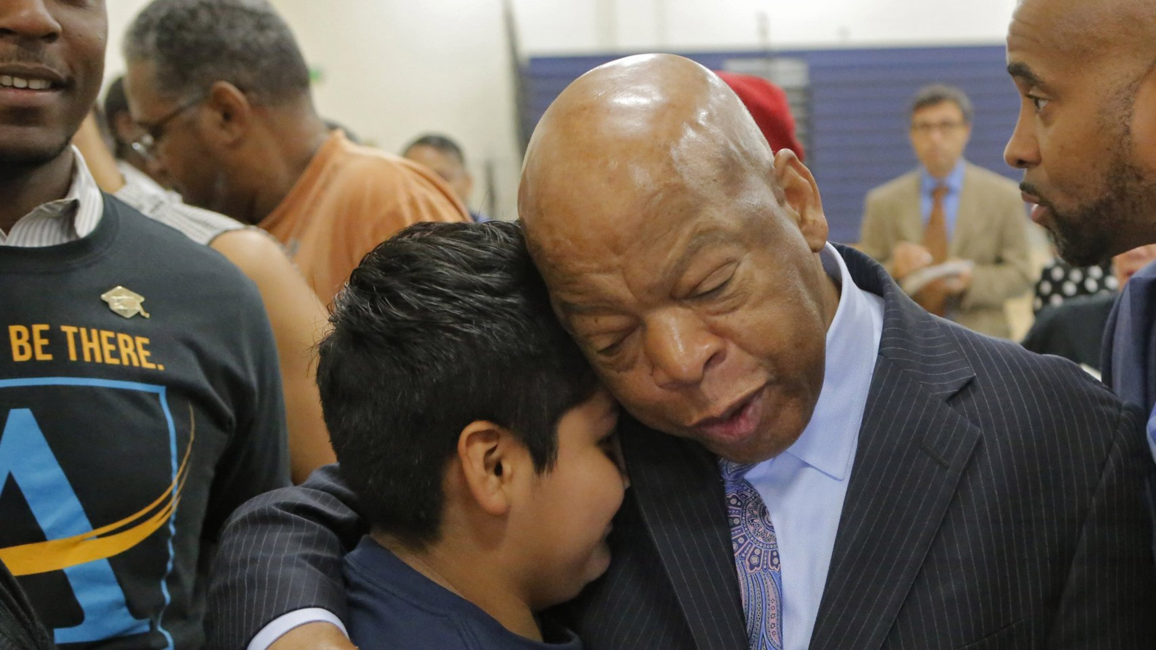 At the end of the program John Lewis spent time with students for hugs and taking photos, including Hugo Hernandez-Cruz. Lewis was on hand, along with Atlanta Public Schools Superintendent Meria Carstarphen for the first day at the new John Lewis Invictus Academy. BOB ANDRES /BANDRES@AJC.COM
