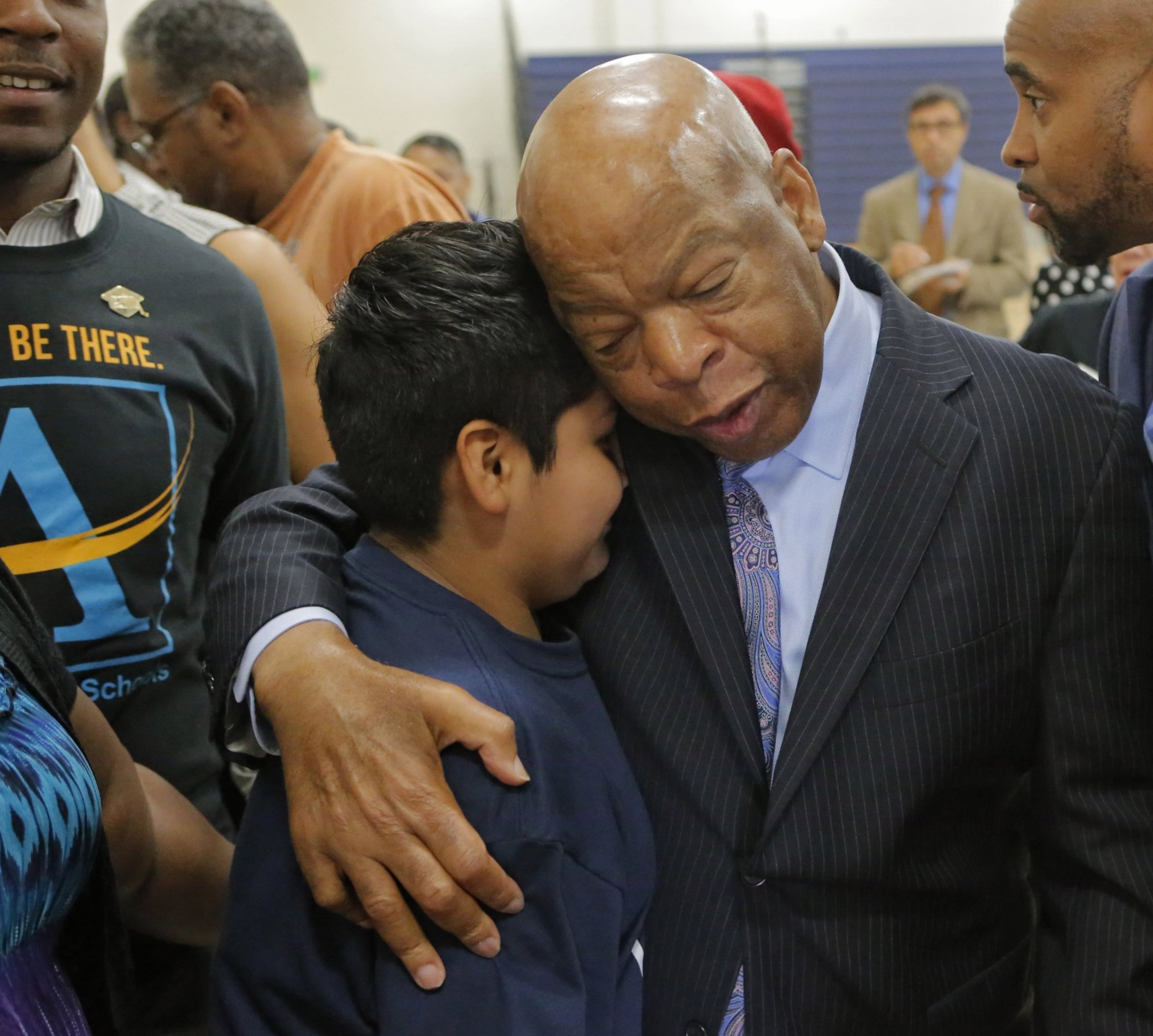 At the end of the program John Lewis spent time with students for hugs and taking photos, including Hugo Hernandez-Cruz. Lewis was on hand, along with Atlanta Public Schools Superintendent Meria Carstarphen for the first day at the new John Lewis Invictus Academy. BOB ANDRES /BANDRES@AJC.COM