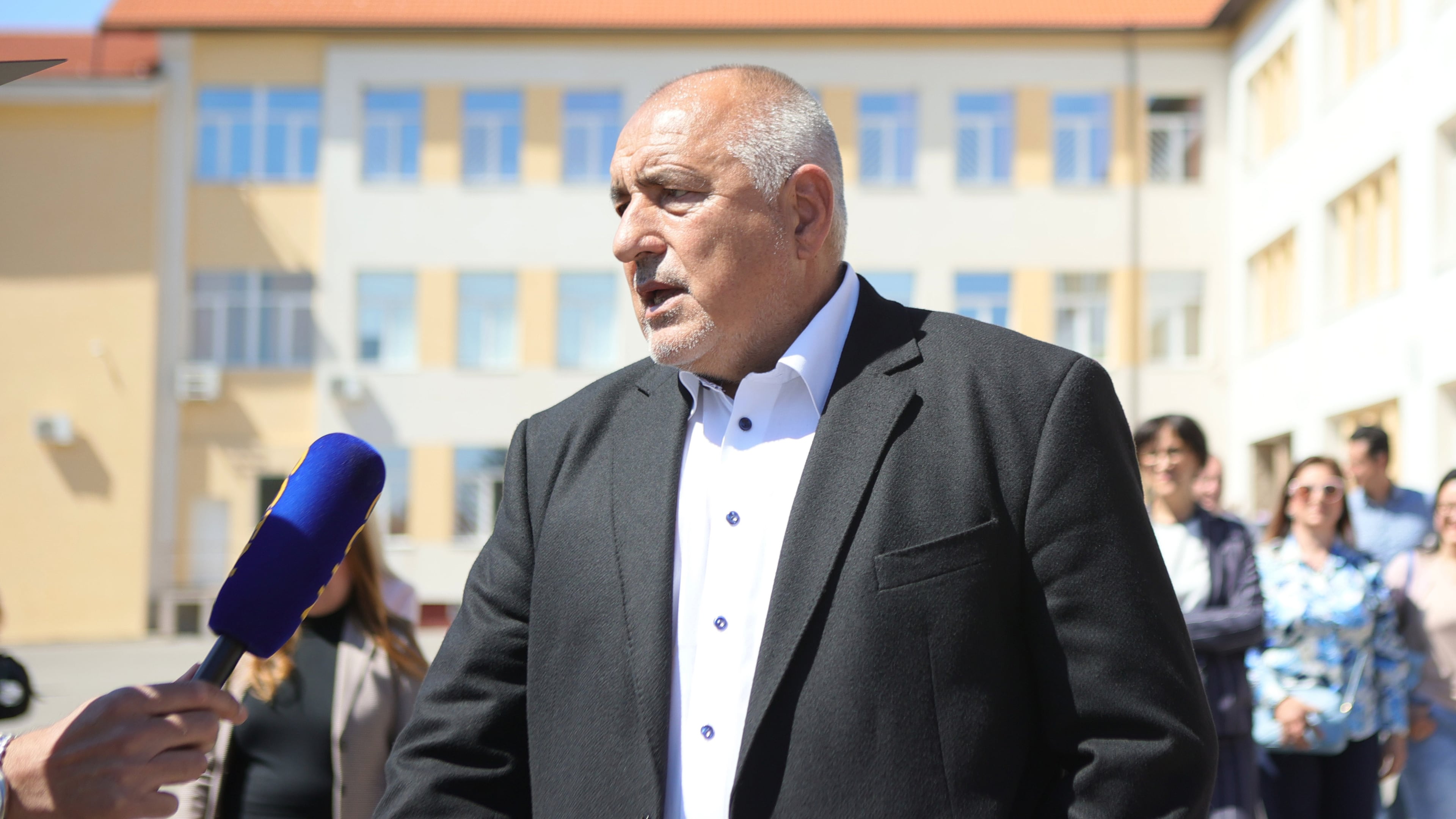 Former Prime Minister Boyko Borissov speaks to journalists after casting his vote in a polling station in Bankya, Bulgaria, Sunday, April 19, 2026, during early parliamentary elections. (AP Photo/Valentina Petrova)