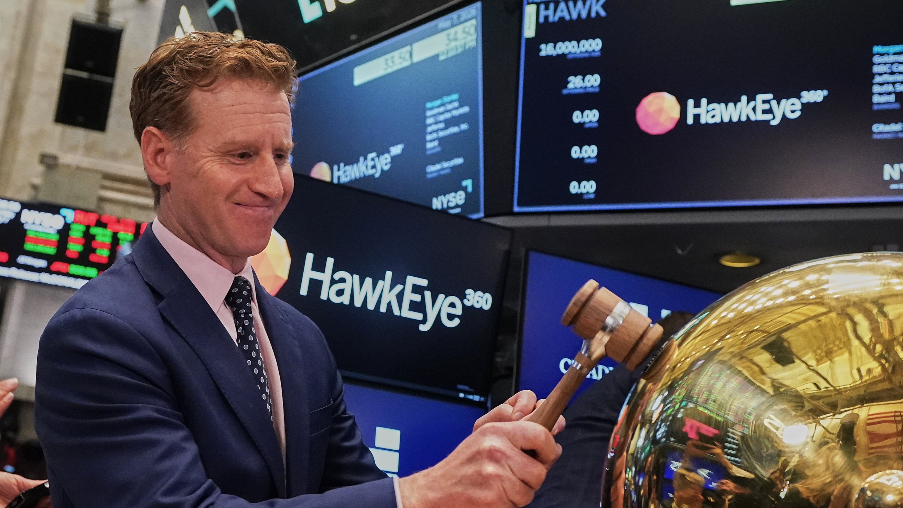 HawkEye 360 CEO John Serafini rings a ceremonial bell on the floor of the New York Stock Exchange as his company's IPO begins trading, Thursday, May 7, 2026. (AP Photo/Richard Drew)