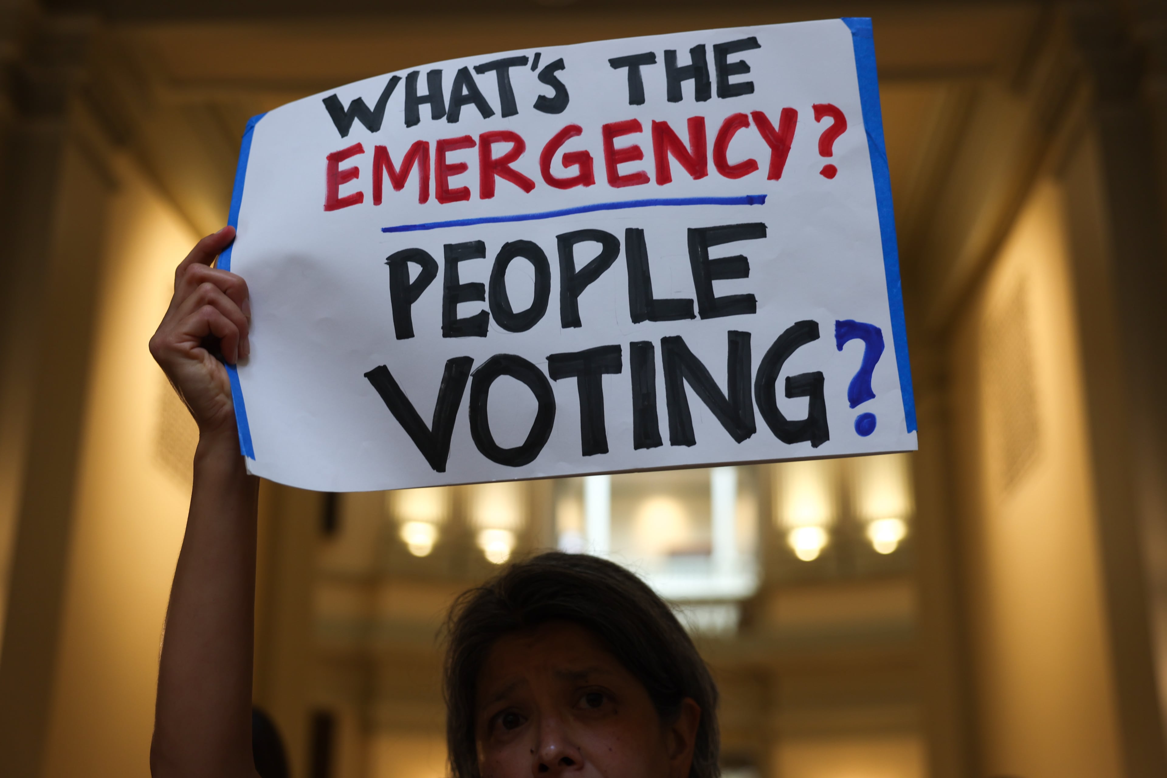 Activists opposed to redistricting, including Marjorie Pak, gather at a press conference before the state legislature convenes for a special session in Atlanta on June 17, 2026. After Georgia Republican leaders announced that they wouldn’t redraw the state’s political maps during the session, state Sen. Max Burns, R-Sylvania, introduced legislation to delay an implementation date to end counting votes with QR codes. (Arvin Temkar/AJC)