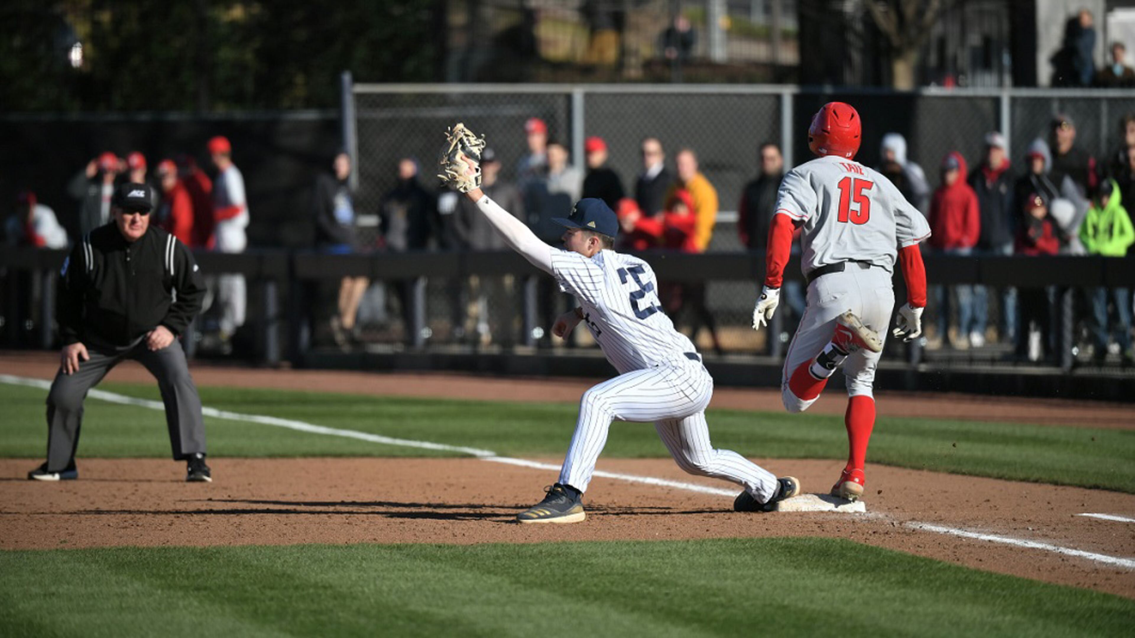 Georgia Tech first baseman Drew Compton and Georgia's Cole Tate meet in a close play at first base in Georgia's 12-0 victory at Russ Chandler Stadium in Atlanta on Feb. 29, 2020. (Photo by Danny Karnik/Georgia Tech Athletics)
