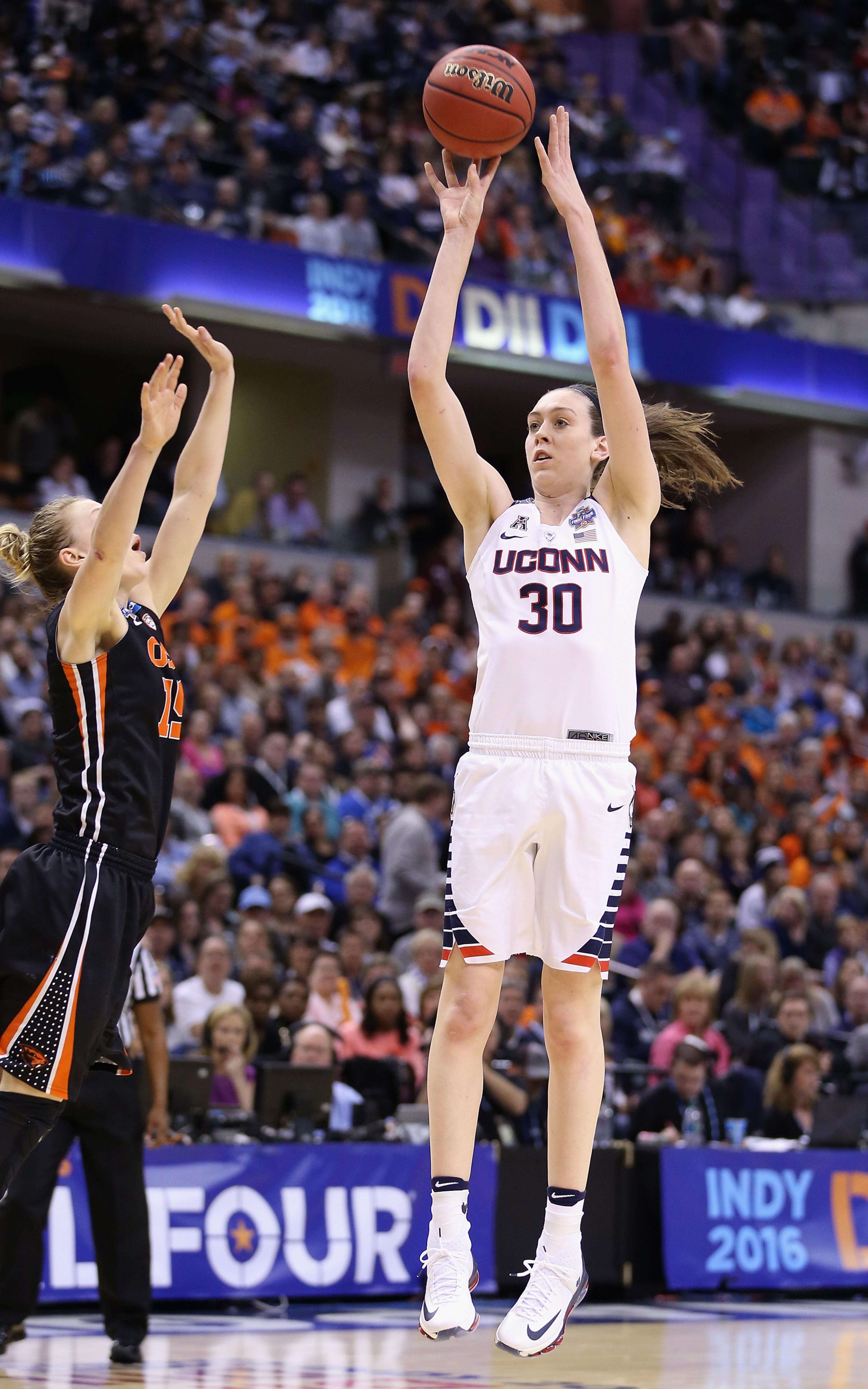 INDIANAPOLIS, IN - APRIL 03: Breanna Stewart #30 of the Connecticut Huskies shoots against Jamie Weisner #15 of the Oregon State Beavers in the fourth quarter during the semifinals of the 2016 NCAA Women's Final Four Basketball Championship at Bankers Life Fieldhouse on April 3, 2016 in Indianapolis, Indiana. (Photo by Andy Lyons/Getty Images)