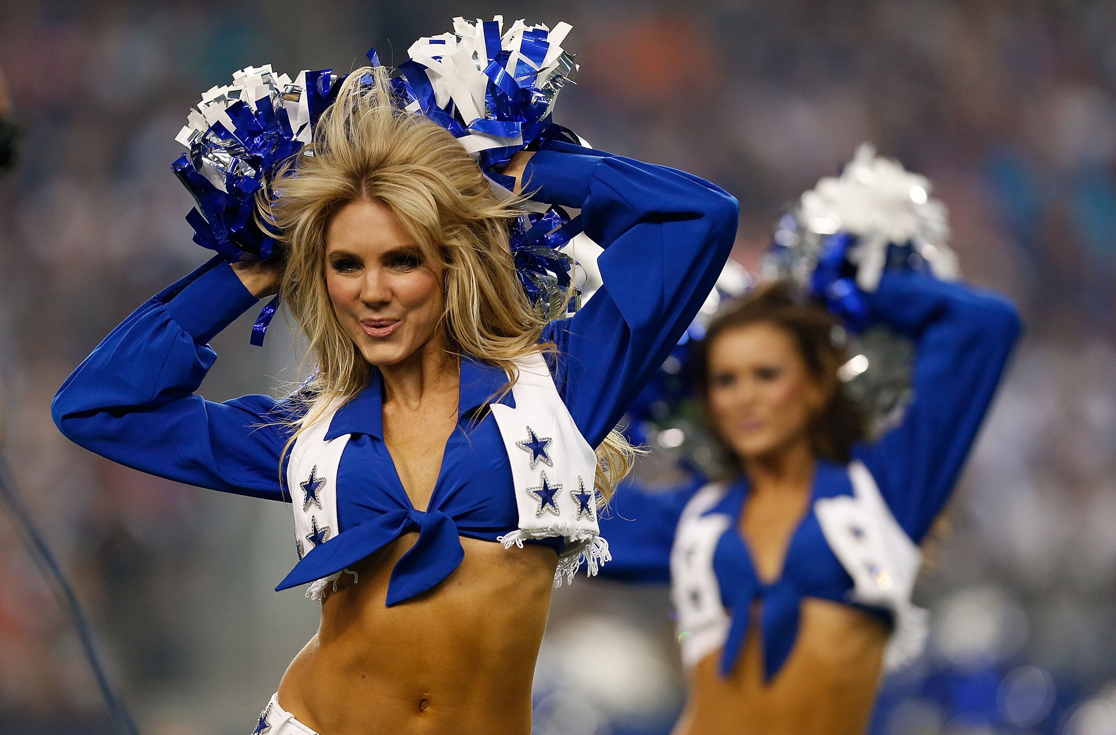 ARLINGTON, TX - AUGUST 16: Dallas Cowboys Cheerleaders perform during the preseason game against the Baltimore Ravens at AT&T Stadium on August 16, 2014 in Arlington, Texas. (Photo by Tom Pennington/Getty Images)