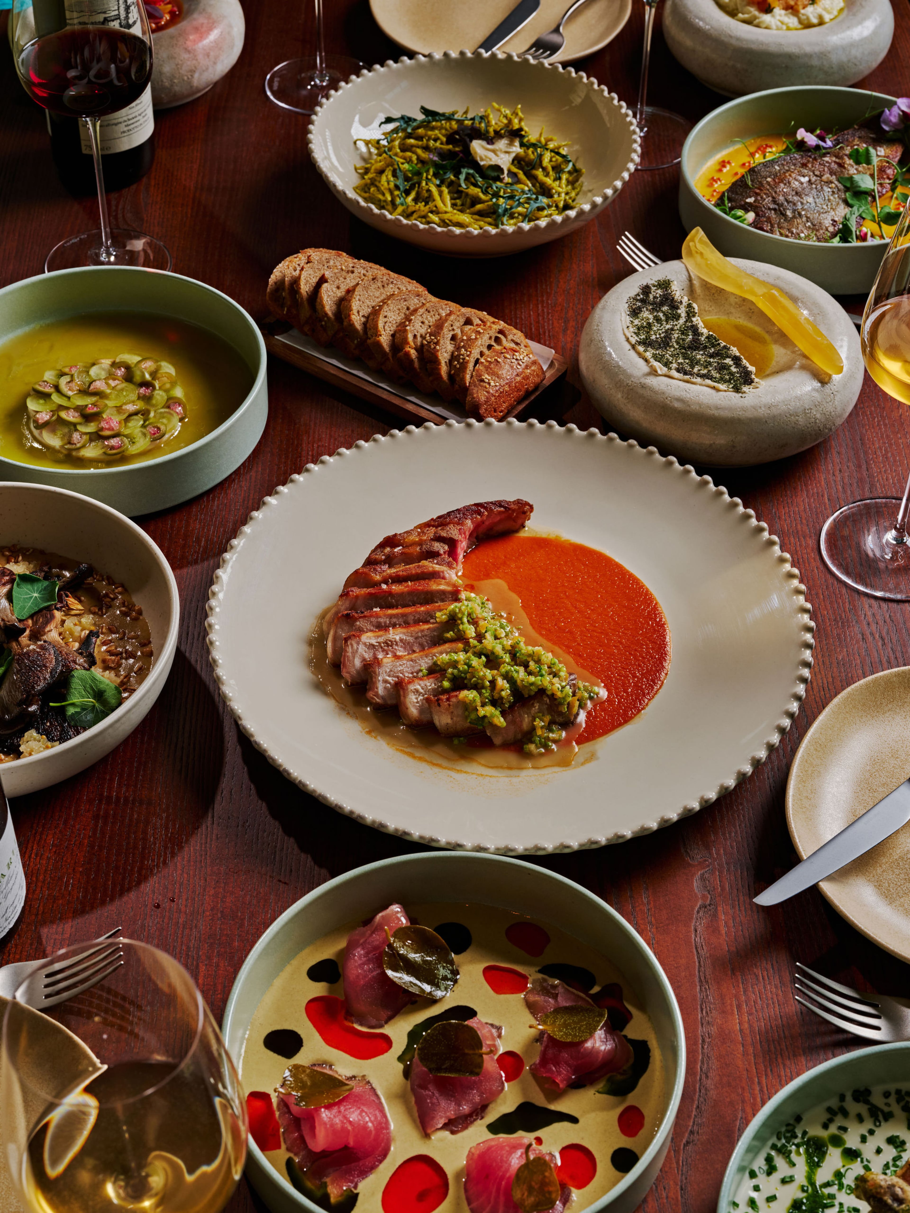 A selection of dishes, including the artistically plated tuna carpaccio in the foreground, are ready to be devoured at Füm. (Courtesy of Füm)