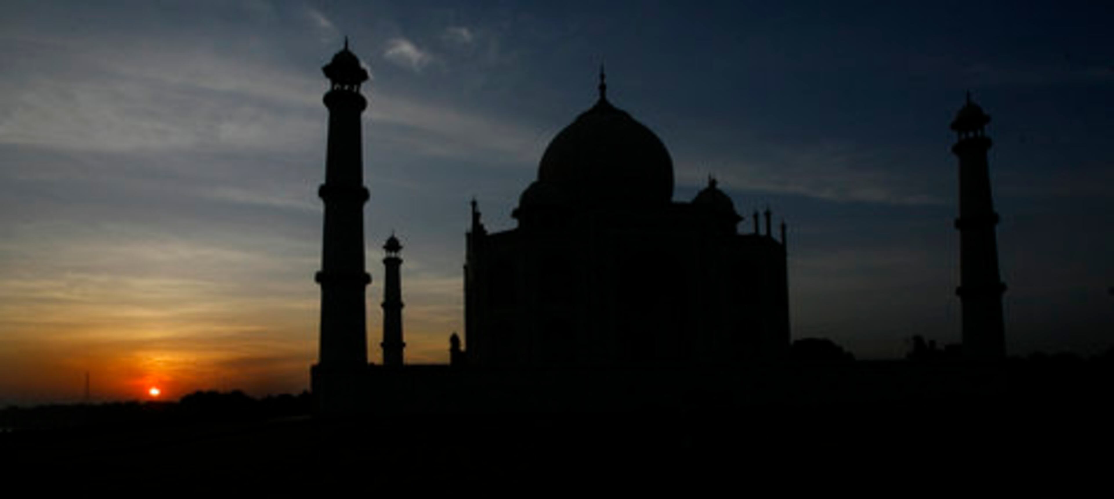 The Taj Mahal in Agra, India, glows in the early-morning eclipse light.