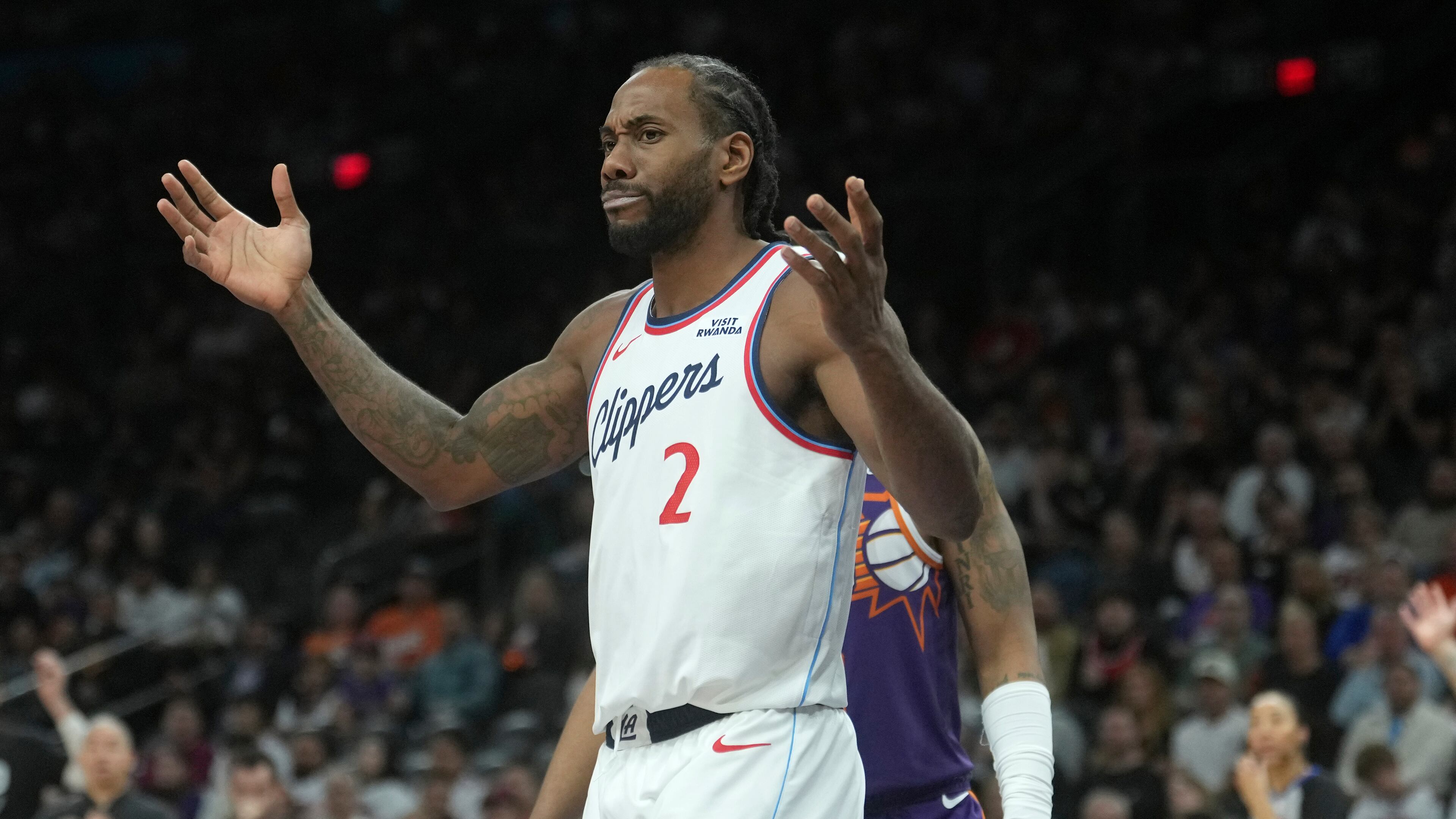 Los Angeles Clippers forward Kawhi Leonard looks for a foul to be called by officials during the second half of an NBA basketball game against the Phoenix Suns Sunday, Feb. 1, 2026, in Phoenix. (AP Photo/Ross D. Franklin)