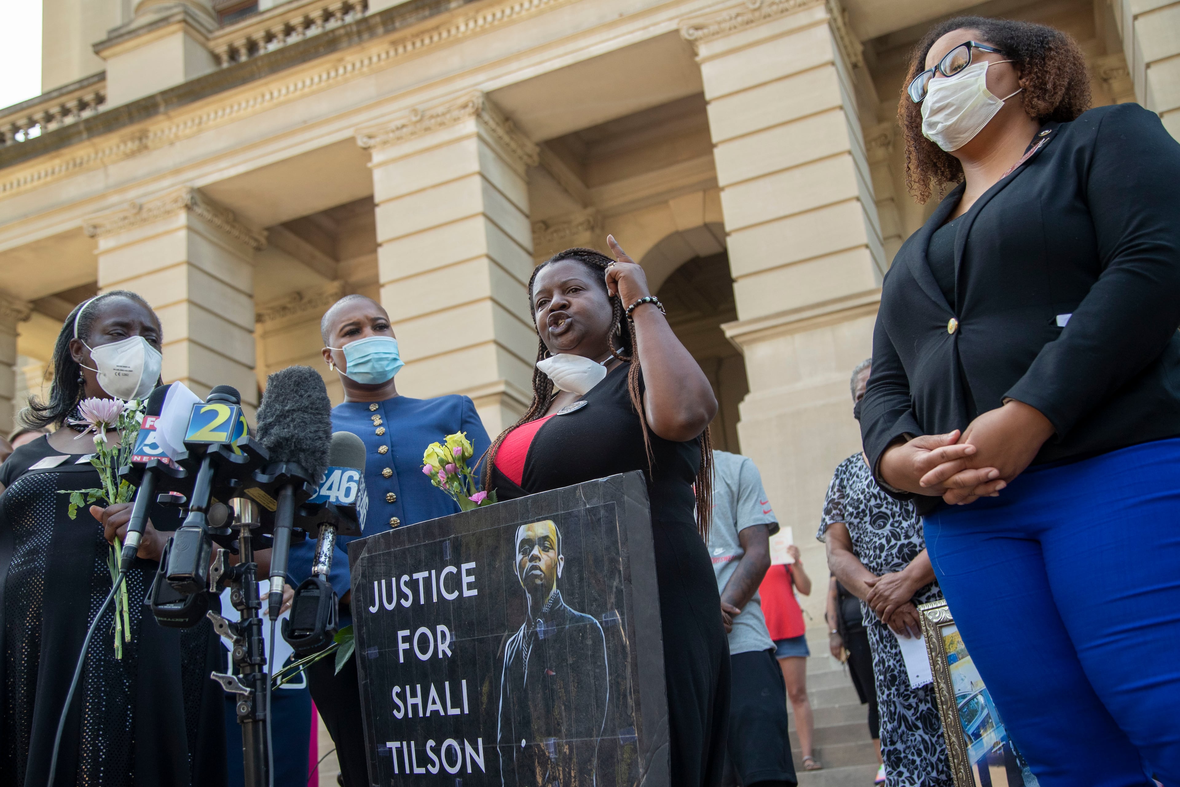 06/02/2020 - Atlanta, Georgia - Tynesha Tilson holds a photo of her late son, Shali Tilson, as she speaks during a press conference on the steps of the Georgia State Capitol Building in Atlanta, Tuesday, June 2, 2020. A special grand jury found that the death of Shali Tislon, a 22-year-old inmate at the Rockdale County jail in 2018, was "preventable" and was caused by staff complacency and lack of procedure. The press conference was hosted by several local Democratic legislatures who were showing support for mother's who that are seeking justice for the deaths of their sons by police officers. The legislatures spoke about HB HB 636 or the
Use of Force Data Collection Act. (ALYSSA POINTER / ALYSSA.POINTER@AJC.COM)