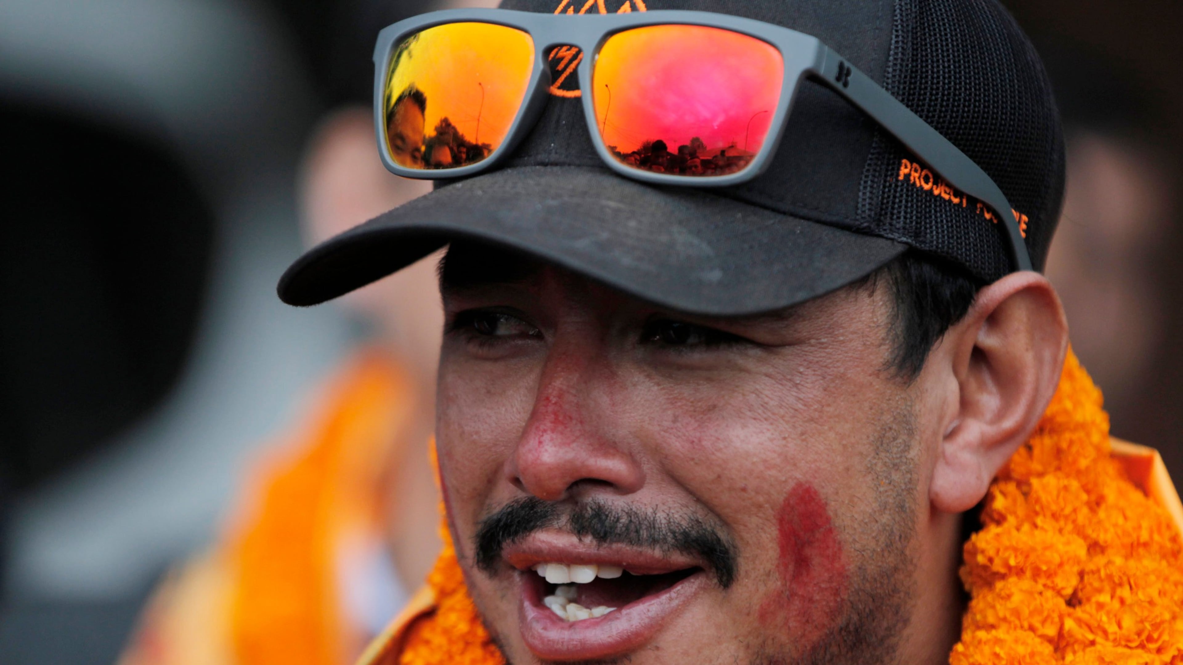 FILE - Nepalese mountaineer Nirmal Purja, who became the fastest climber of the world's 14 highest peaks, arrives at the airport in Kathmandu, Nepal, on Oct. 30, 2019. (AP Photo/Niranjan Shrestha, File)
