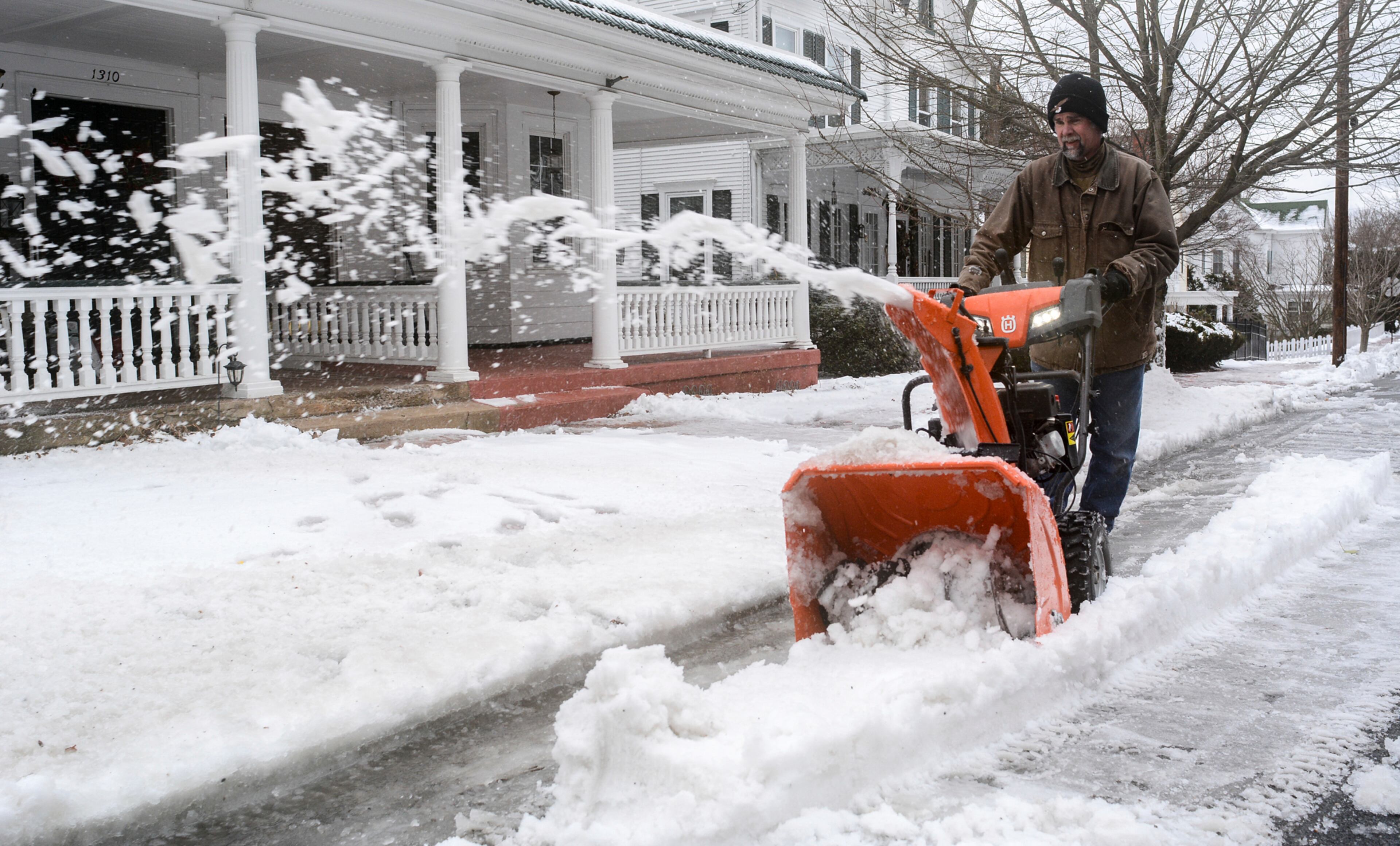Dan Cappella, of Pottsville, Pa., clears snow away on Howard Avenue in Pottsville, Pa., on Sunday, January 20, 2019.