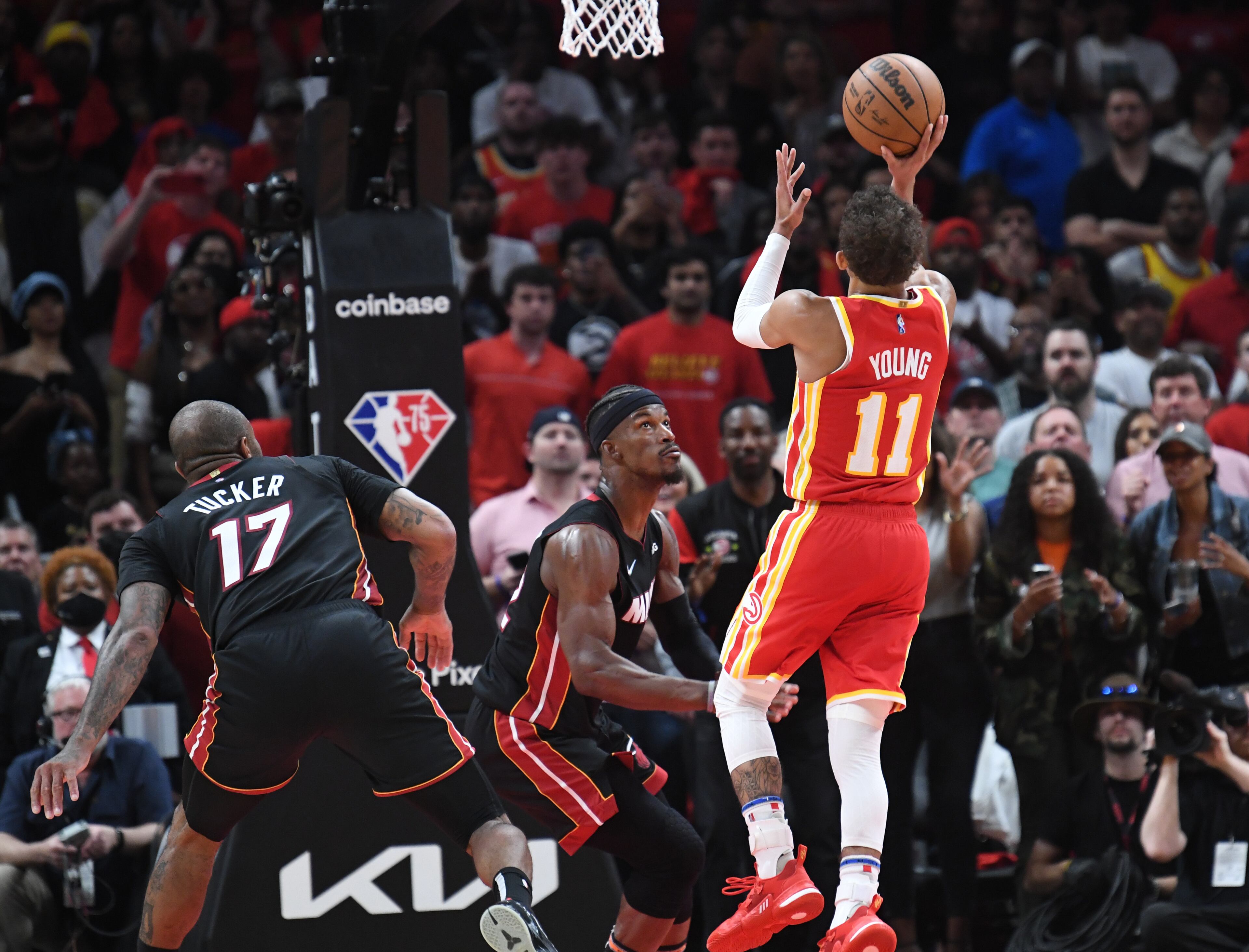 April 22, 2022 Atlanta - Atlanta Hawks' guard Trae Young (11) gets off the game winning shot over Miami Heat's forward Jimmy Butler (22) at the end of the 4th quarter in Game 3 of the first round of the NBA playoffs at State Farm Arena on Friday, April 22, 2022. Atlanta Hawks won 111-110 over Miami Heat. (Hyosub Shin / Hyosub.Shin@ajc.com)
