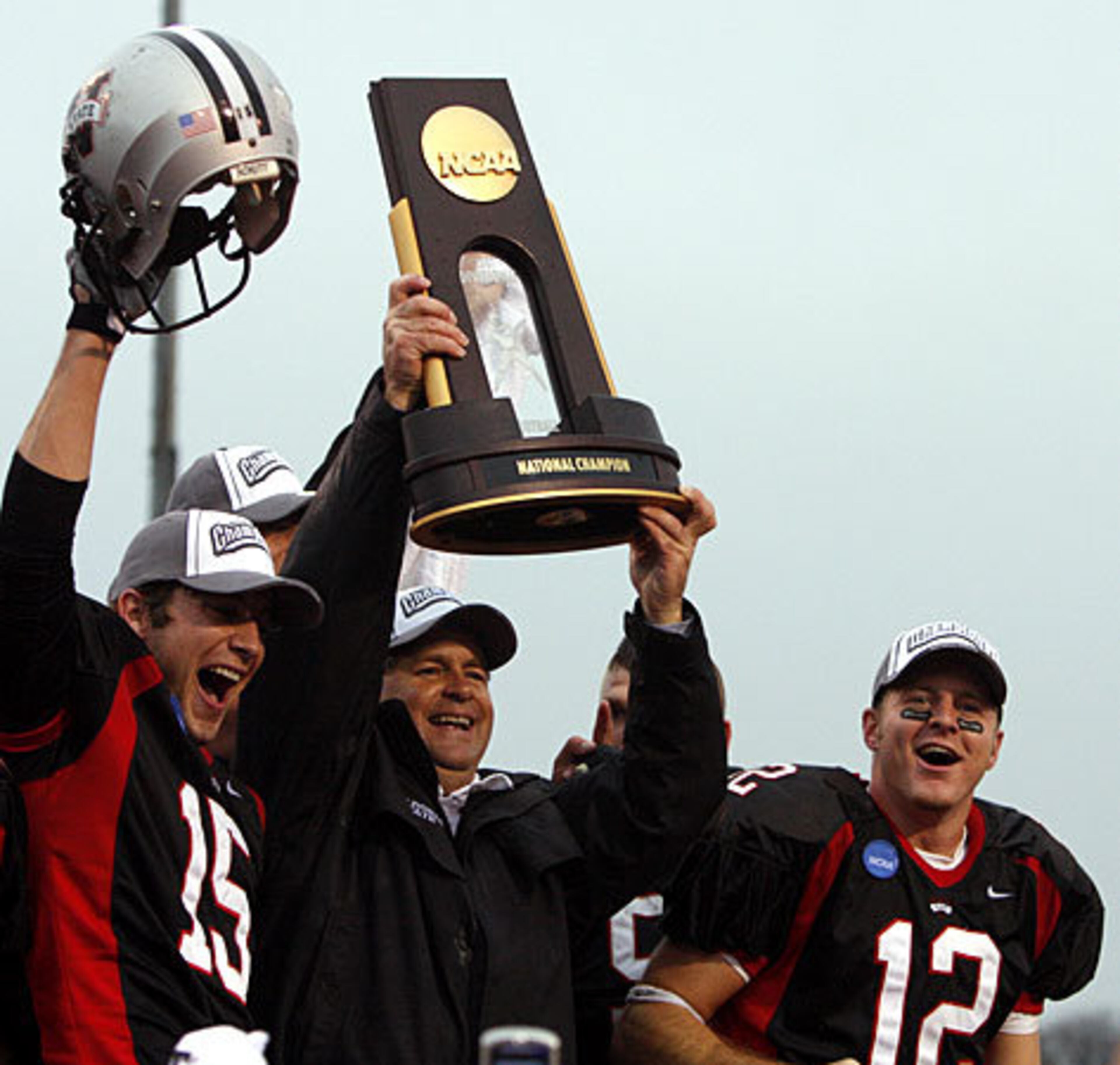 Valdosta State's Clay Callaway (15), coach David Bean, and Tucker Pruitt (12) celebrate their 25-20 win over Northwest Missouri State in the NCAA Division II Championship football game in Florence Ala., Dec. 15, 2007. Since starting a football team in 1980, Valdosta State has notched two National Championship titles (2004,2007).