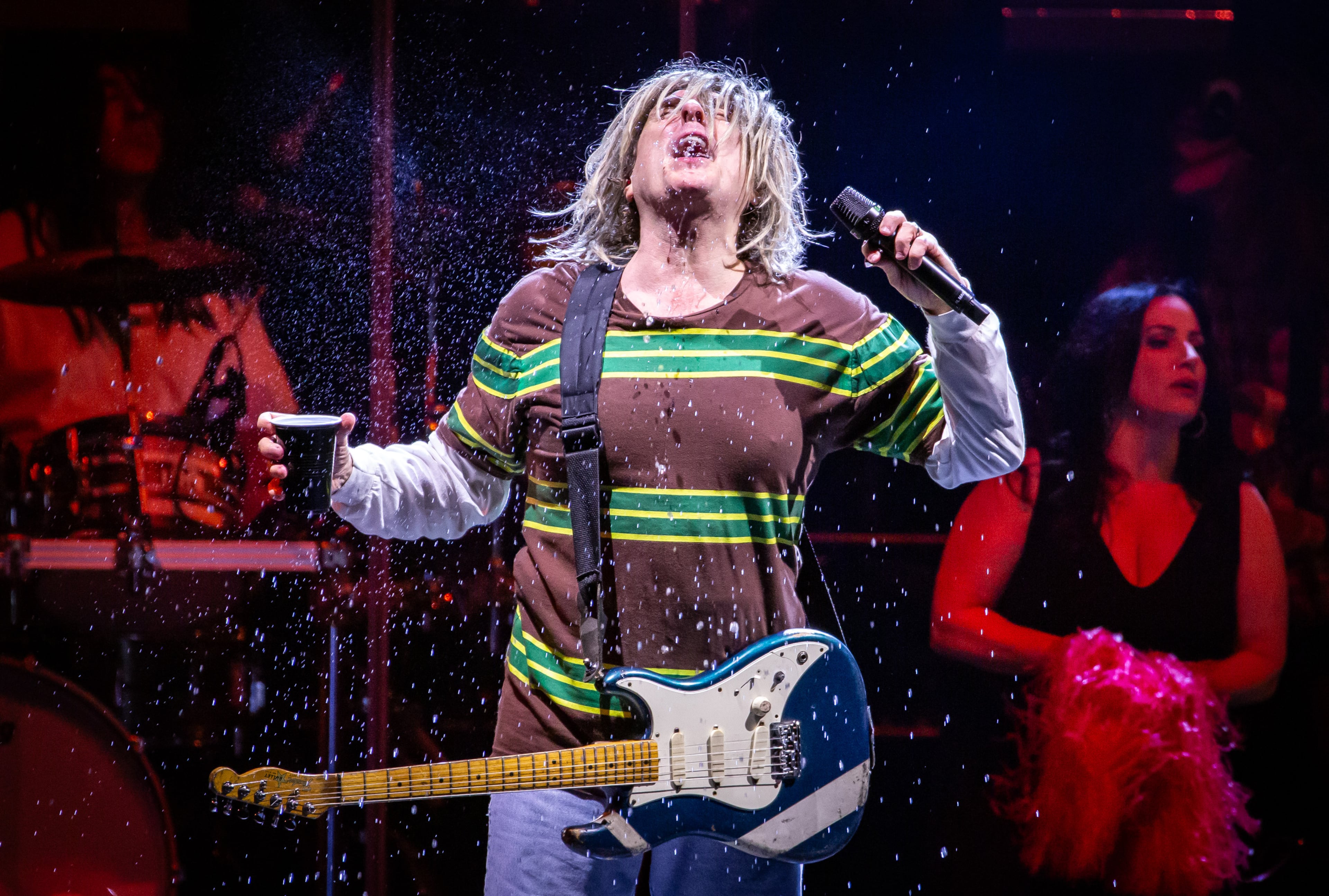 Alpharetta, Ga: "Weird Al" Yankovic playing "Smells Like Nirvana" complete with Cobain-esque costume. Yankovic played a stunningly wide array of his humorous songs Sunday night along with matching costume changes and video montages. Photo taken Sunday May 31, 2026 at Ameris Bank Amphitheatre. 060126 weird al (RYAN FLEISHER FOR THE ATLANTA JOURNAL-CONSTITUTION)