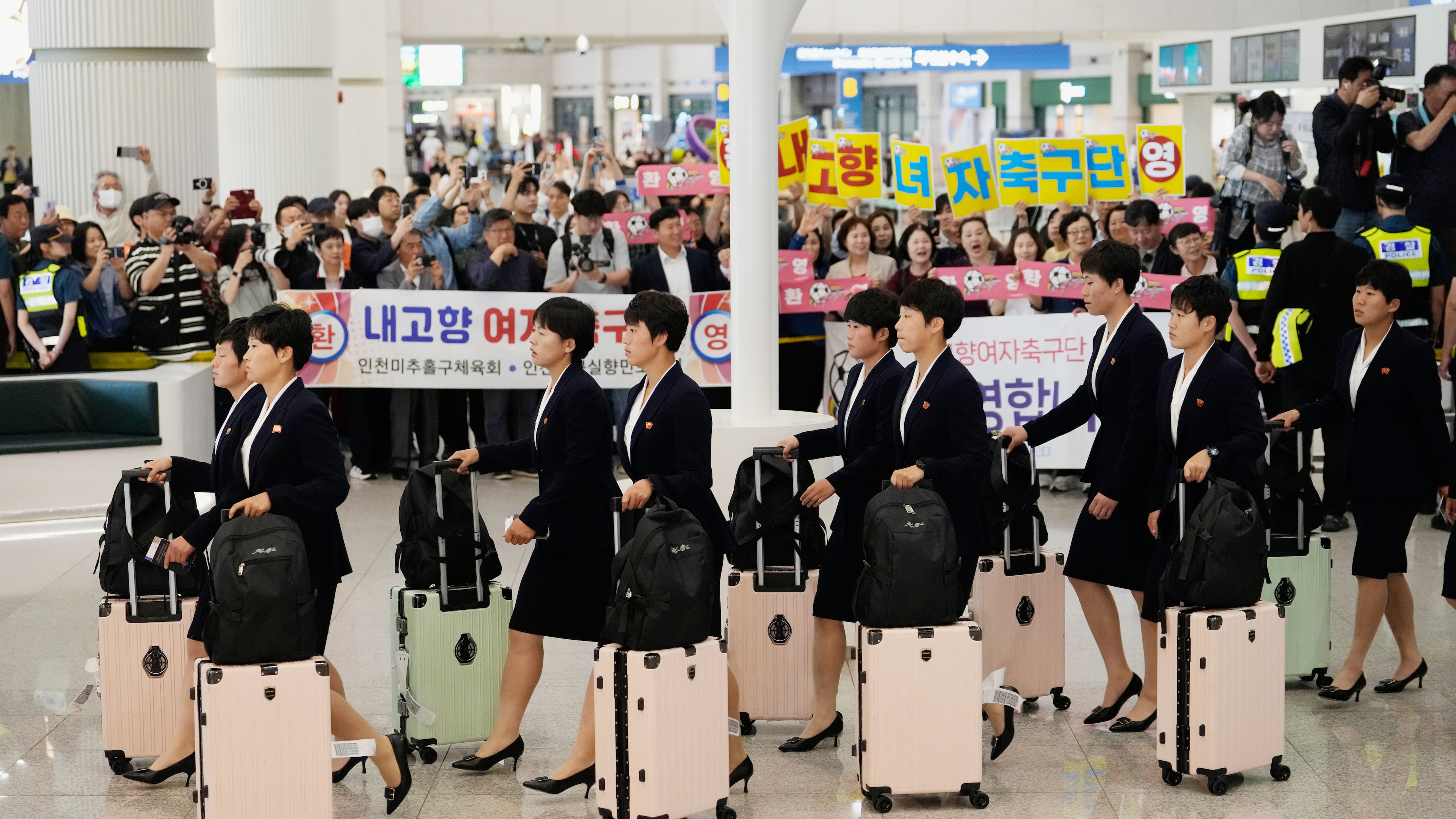 Members of North Korea's soccer club Naegohyang Women's FC team arrives at Incheon International Airpot in Incheon, South Korea, Sunday, May 17, 2026. (AP Photo/Ahn Young-joon)