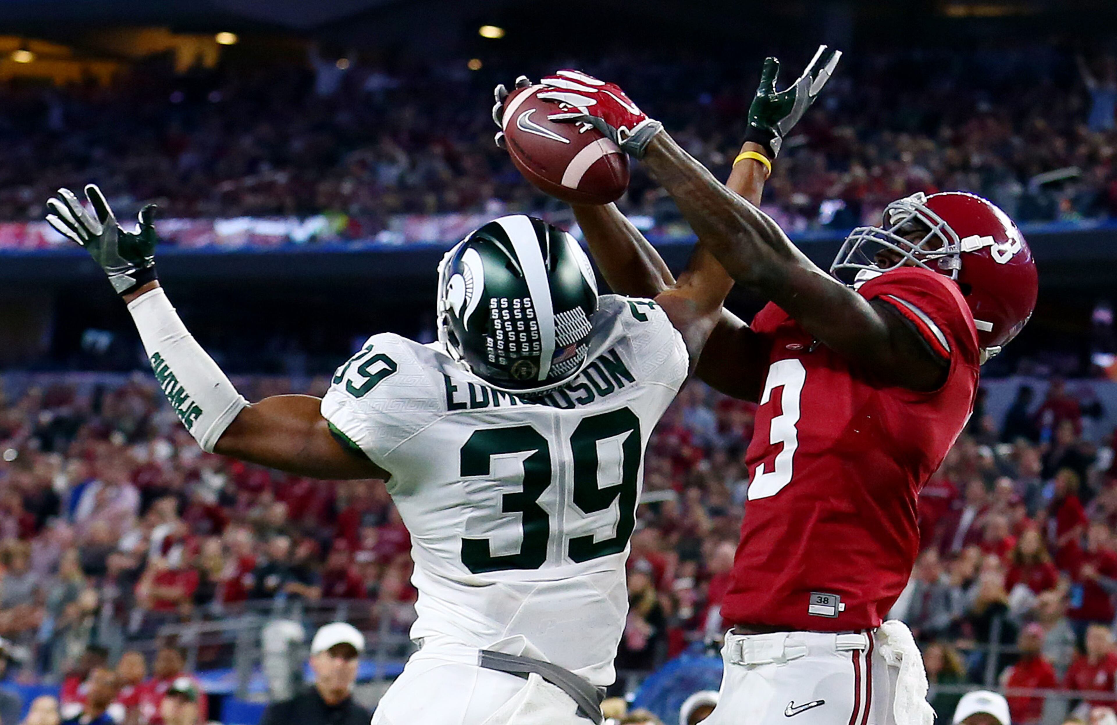 ARLINGTON, TX - DECEMBER 31: Wide receiver Calvin Ridley #3 of the Alabama Crimson Tide catches a six-yard touchdown pass against cornerback Jermaine Edmondson #39 of the Michigan State Spartans in the third quarter during the Goodyear Cotton Bowl at AT&T Stadium on December 31, 2015 in Arlington, Texas. (Photo by Tom Pennington/Getty Images)