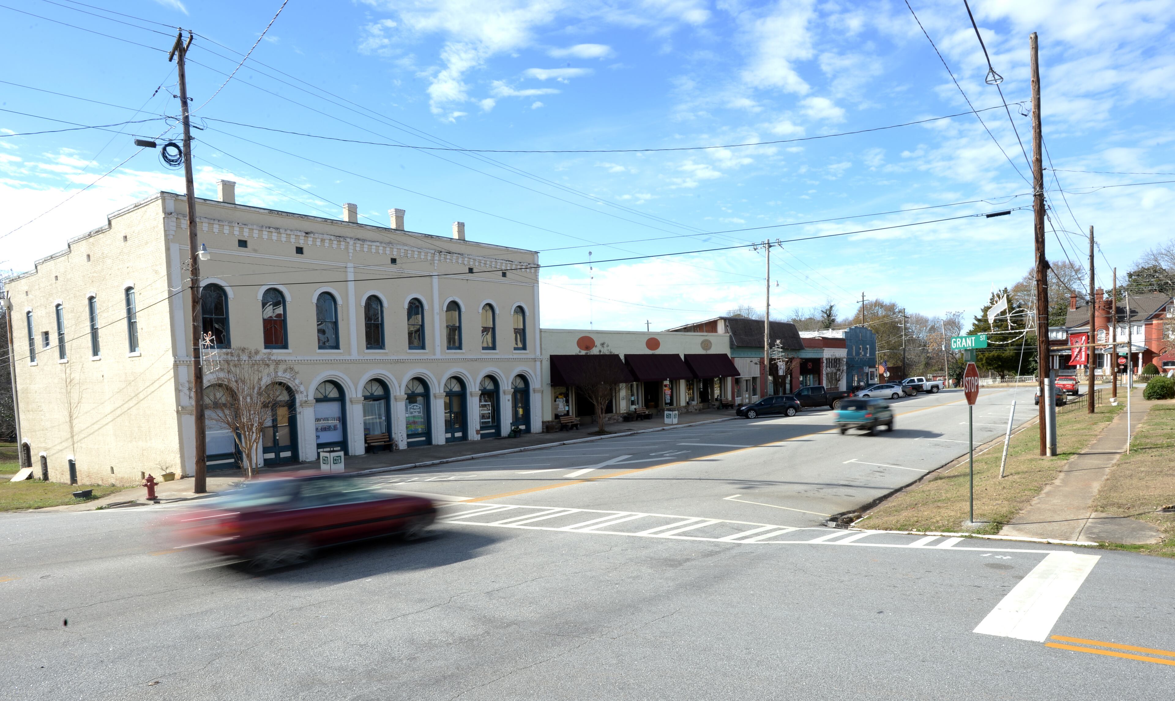 December 13, 2013 Grantville - AMC show The Walking Dead was filmed entirely in Grantville. Picture shows downtown Grantville on Friday, December 13, 2013. Movie production in Georgia is big business not only for production crews and Georgia-based actors: towns increasingly will do whatever is asked of them for their 15 minutes of fame and, hopefully, long-term economic benefit. Jim Sells, major of Grantville, ignored his city council and painted the freight depot to attract an episode of � Walking Dead.�rantville now attracts visitors from around the world. Nearby Senoia also bends over backwards for the zombie movie makers. Covington is famous for the Vampire Diaries (and The Heat of the Night). HYOSUB SHIN / HSHIN@AJC.COM