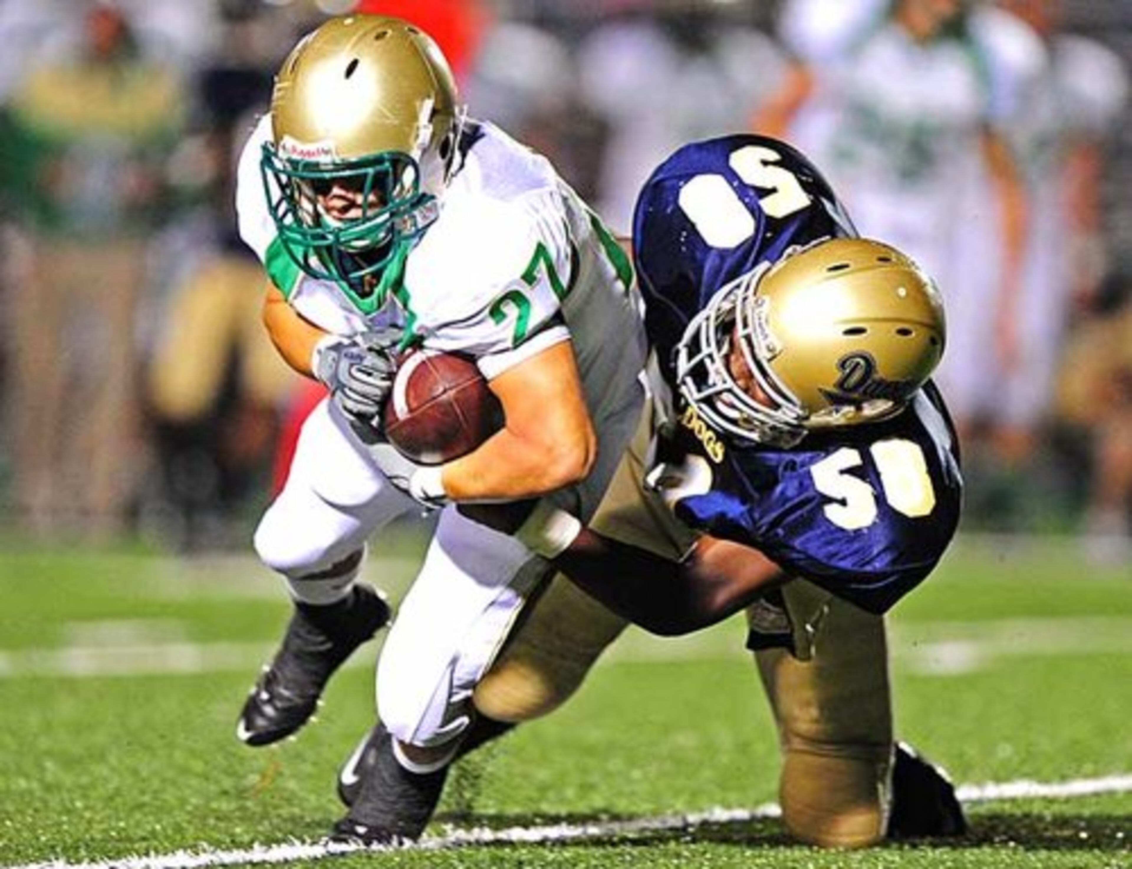 Decatur's Darnell Tigner (58) pulls down Buford's Cody Getz (27).