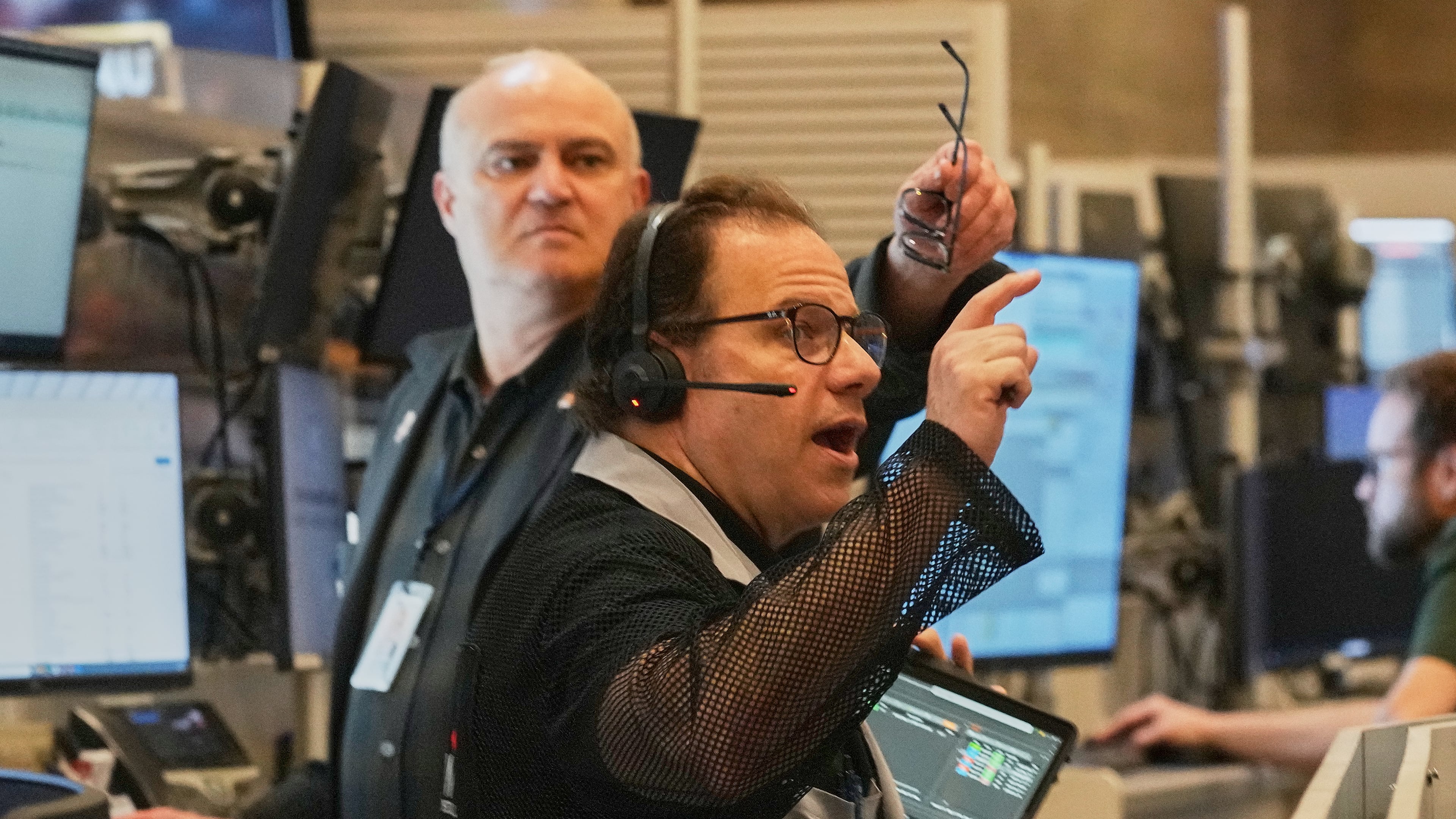 Options trader Anthony Spina, foreground, works on the floor of the New York Stock Exchange, Thursday, April 30, 2026. (AP Photo/Richard Drew)