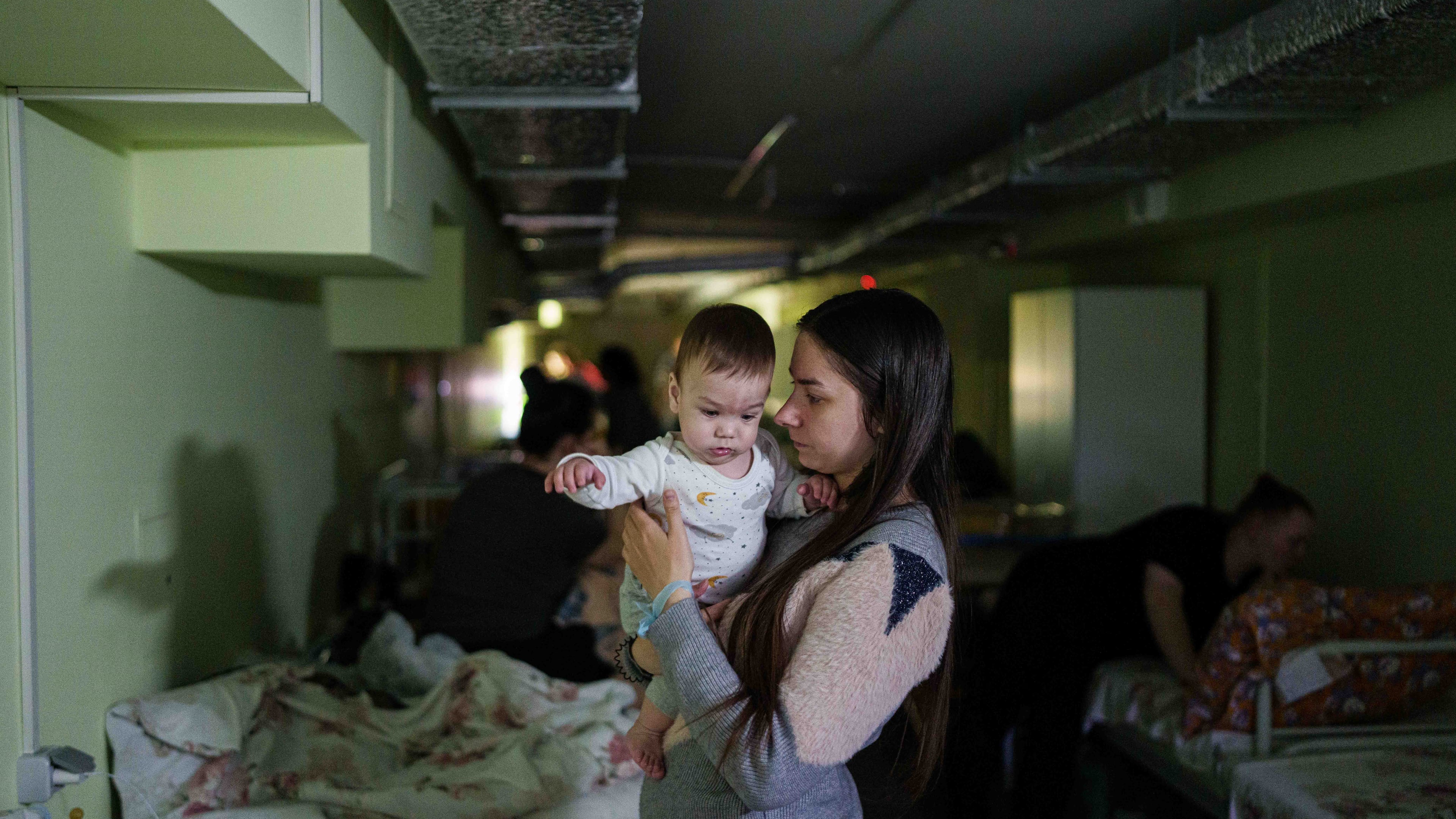 Marharyta Nekhoroshyva holds her son Mark inside a shelter at the children's regional hospital of Zaporizhzhia, Ukraine, on Thursday, May 7, 2026. (AP Photo/Evgeniy Maloletka)