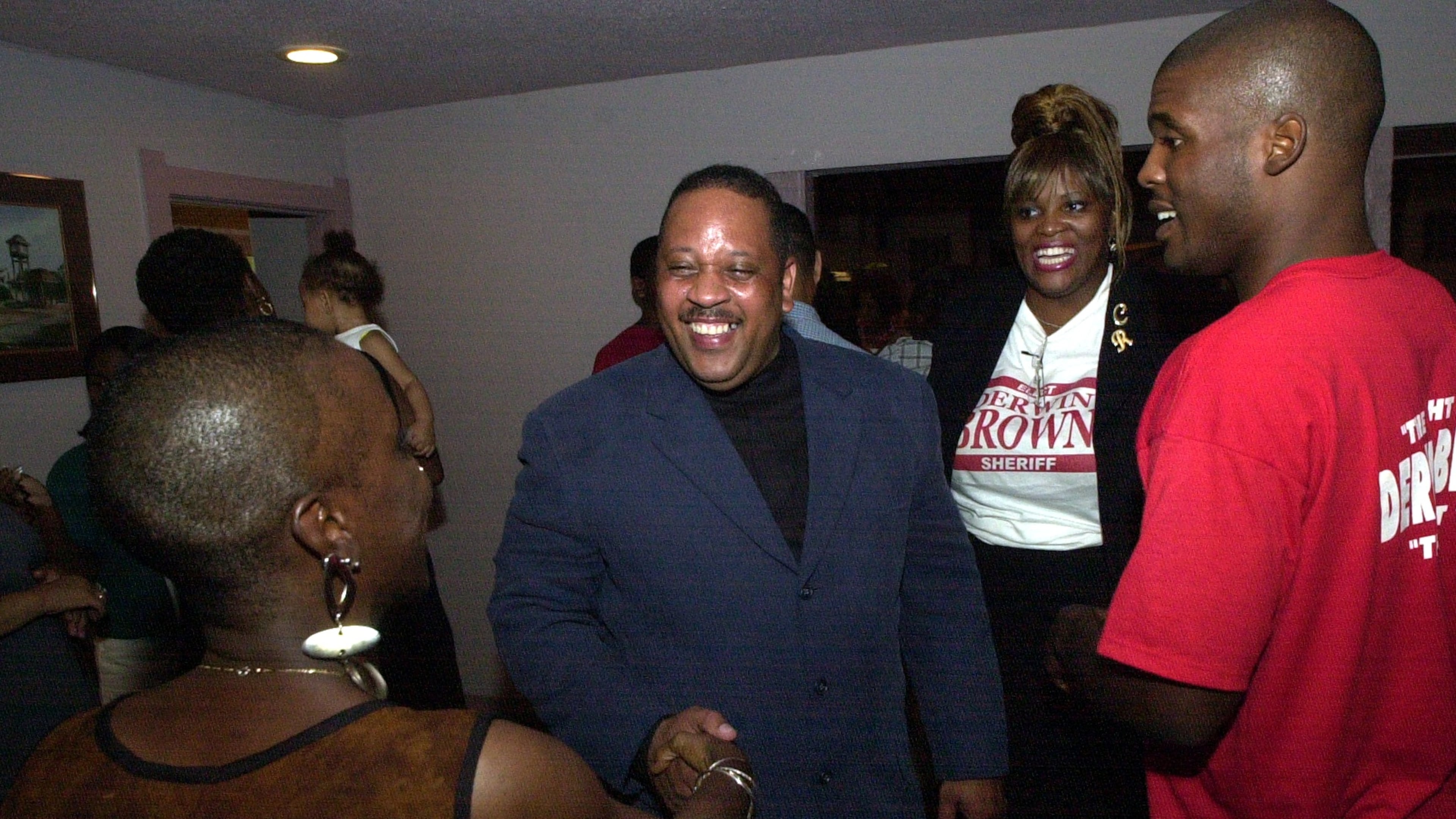 DeKalb County Sheriff-elect Derwin Brown, pictured here with well-wishers at his election victory party in August 2000, was murdered two weeks before taking office on the orders of outgoing Sheriff Sidney Dorsey. (Kent D. Johnson/AJC)