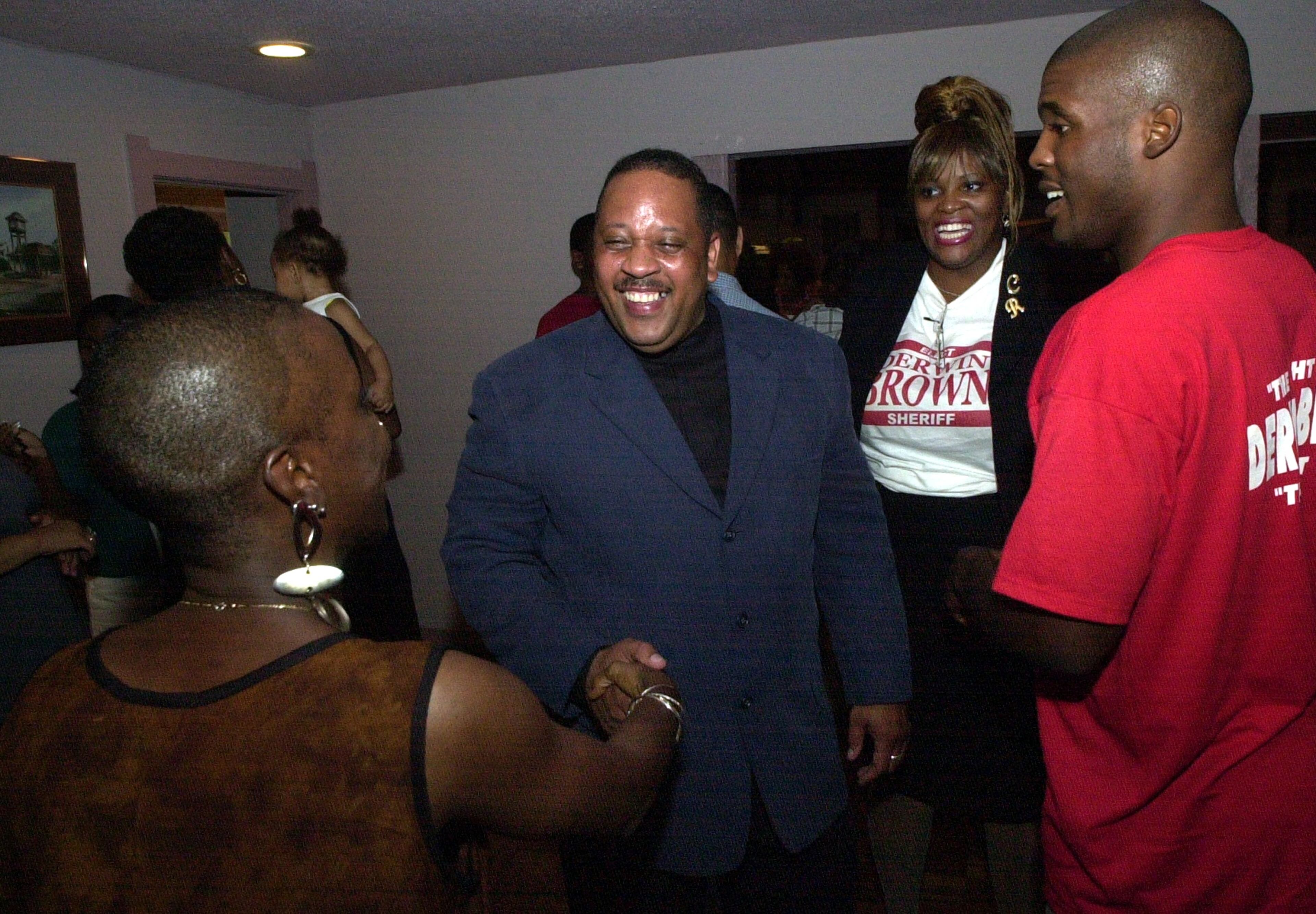 Derwin Brown, DeKalb County Sheriff-elect, greeted well-wishers at his election victory party in Stone Mountain on Aug. 8, 2000. (KENT D. JOHNSON/AJC File)