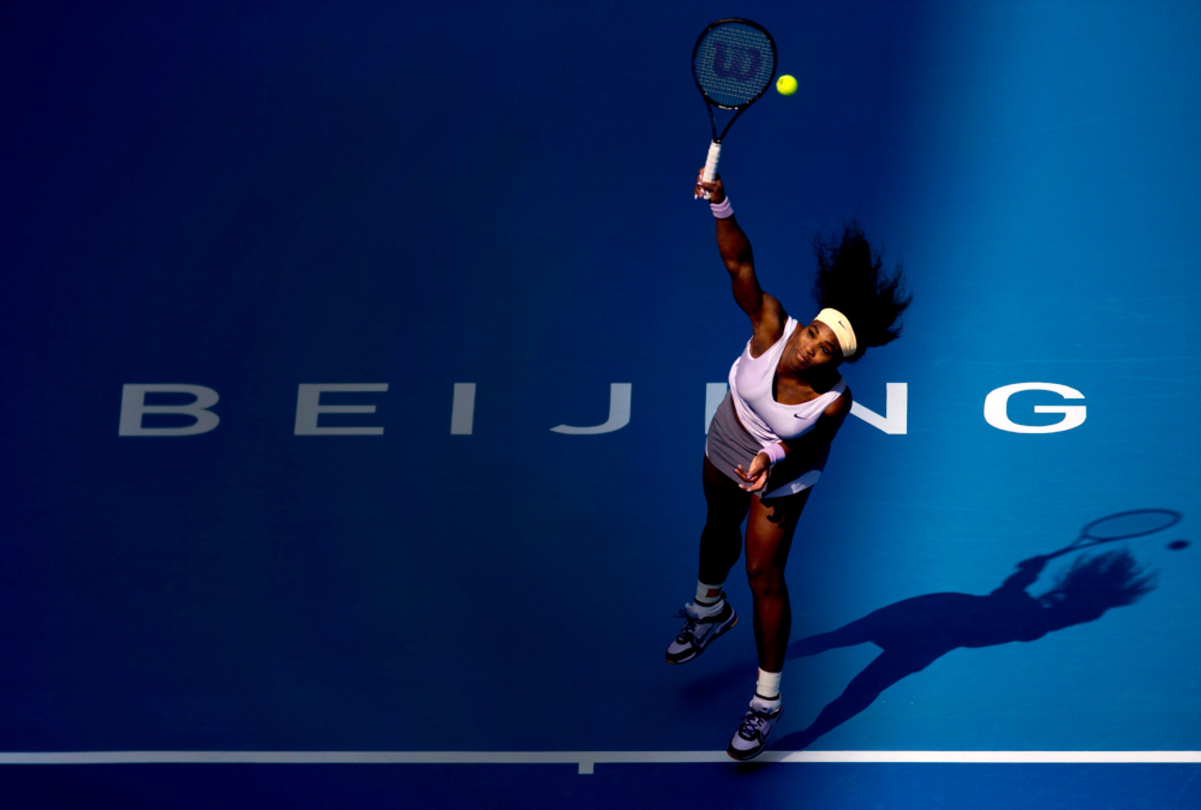 SERVING IT UP--Serena Williams of U.S. serves to Maria Kirilenko of Russia during the China Open tennis tournament at the National Tennis Stadium in Beijing, China, Thursday, Oct. 3, 2013. (AP Photo/Andy Wong)