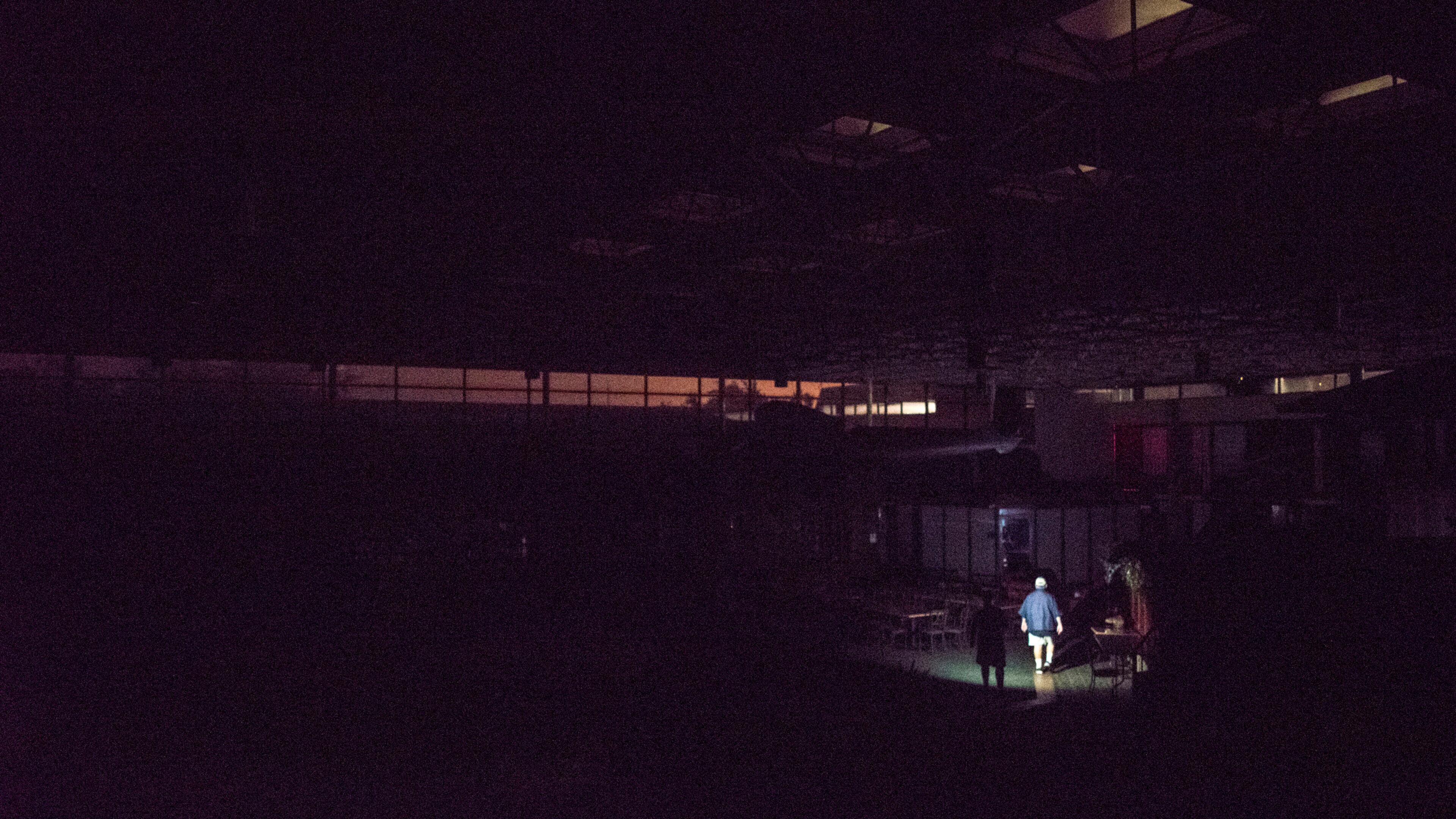 Guests leave their rooms at the Quality Inn Conference Center after power went out during Hurricane Irma's arrival in Jacksonville Beach, Fla., Sept. 11, 2017. The National Weather Service reported Monday that flooding from a storm surge in Jacksonville had exceeded a record set by Hurricane Dora in 1964 (Johnny Milano/The New York Times)