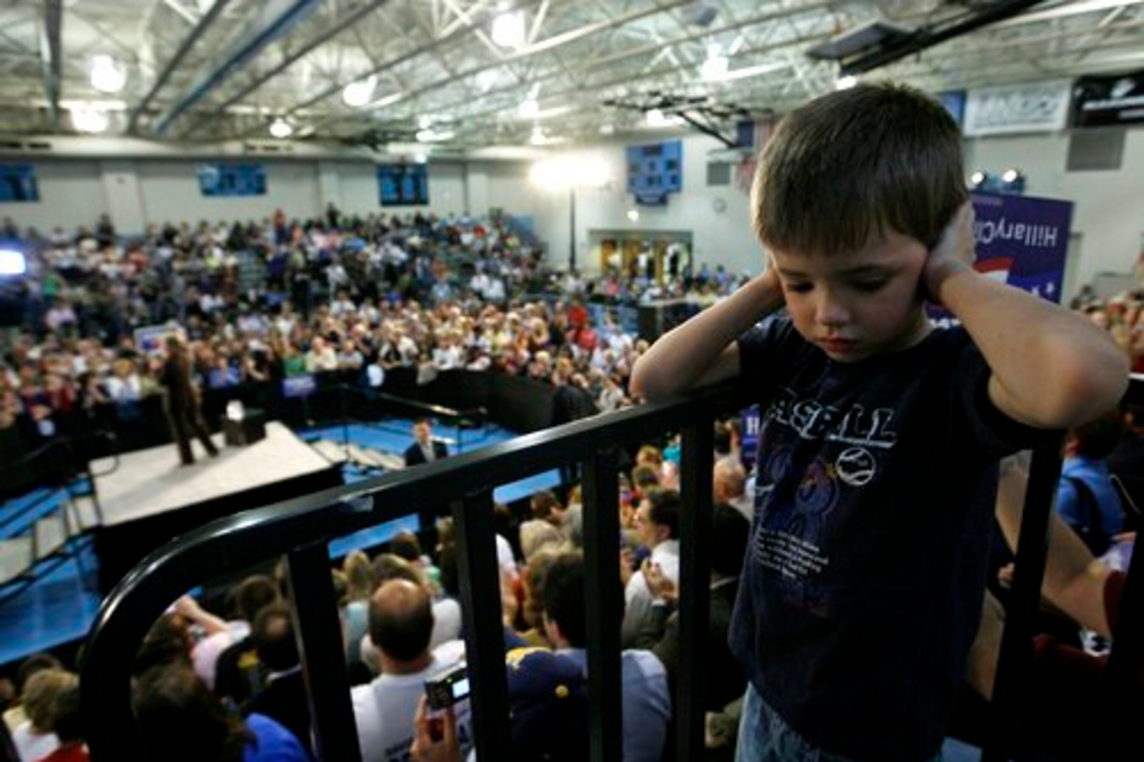 Gabriel Shaffer-Merriman, 5, covers his ears from the loud speakers as Democratic presidential hopeful Sen. Hillary Rodham Clinton (D-N.Y.) campaigns in Johnstown, Pa., on Sunday.