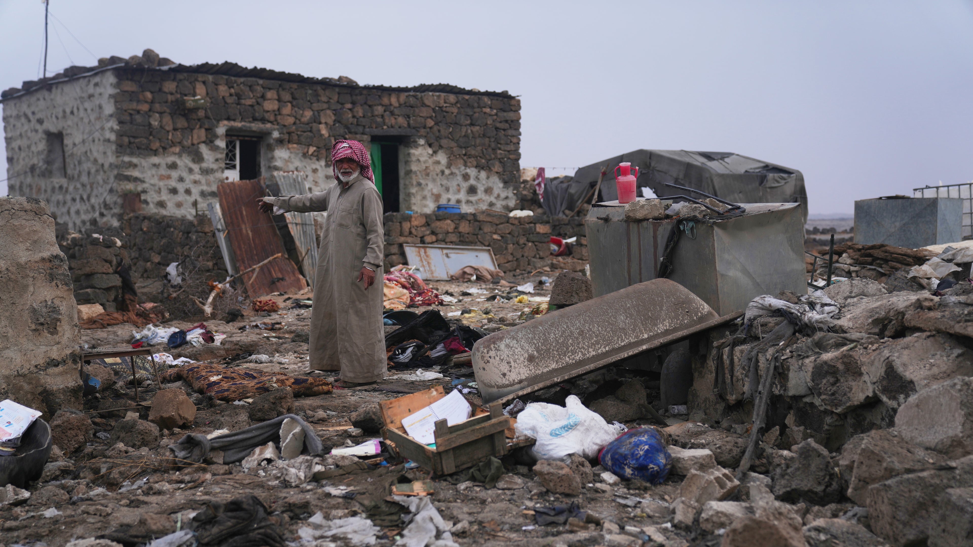 A man inspects the aftermath of a Jordanian airstrike in Al-Tuff, in the countryside of Daraa province in southern Syria, Tuesday, Oct. 27, 2026. (AP Photo/Ghaith Alsayed)