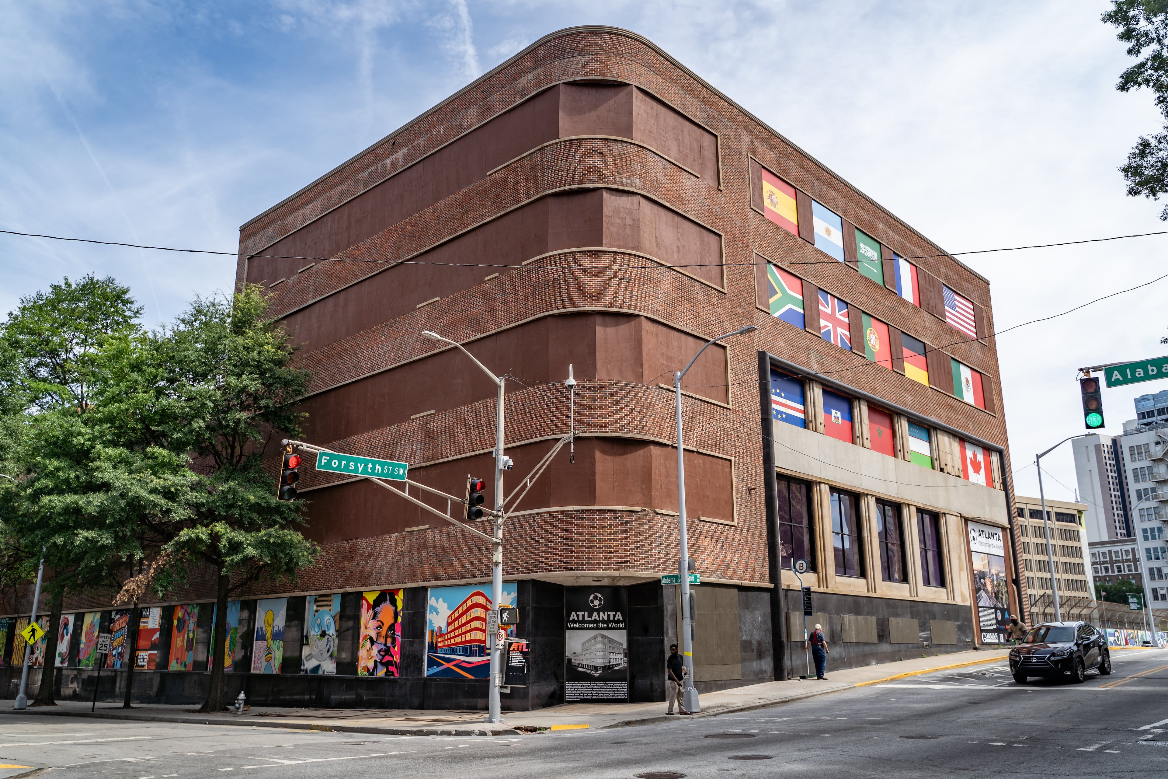 Mutliple murals line the exterior walls of the abandoned Atlanta Constituion building on Friday, June 5, 2026. (Ben Hendren for the AJC)