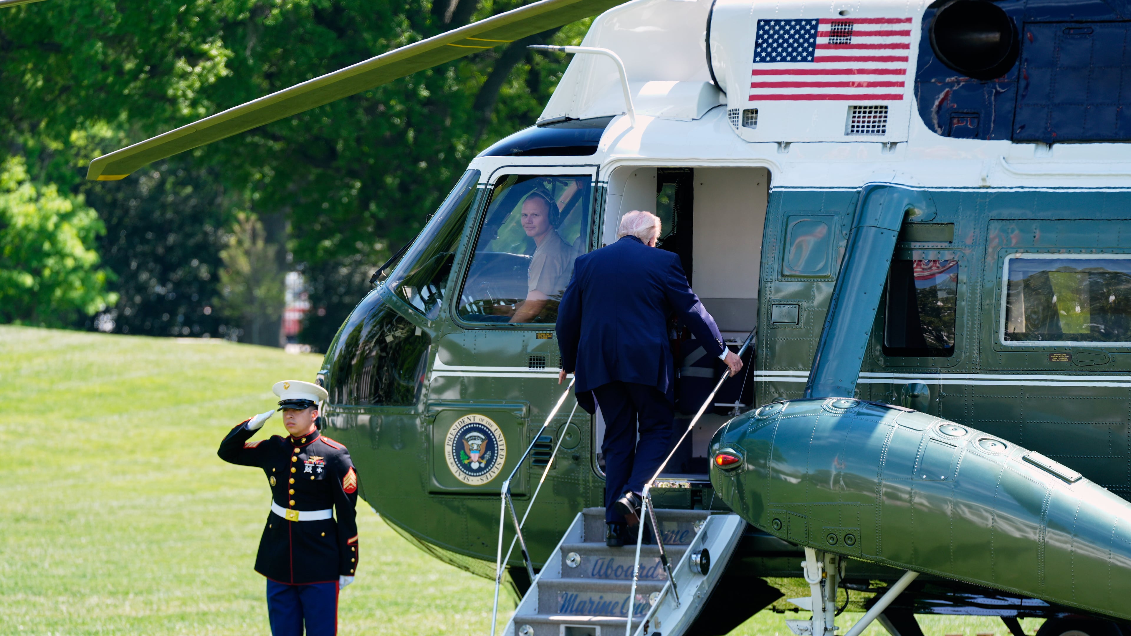 President Donald Trump boards Marine One as he departs the White House, Thursday, April 16, 2026, in Washington. (AP Photo/Manuel Balce Ceneta)