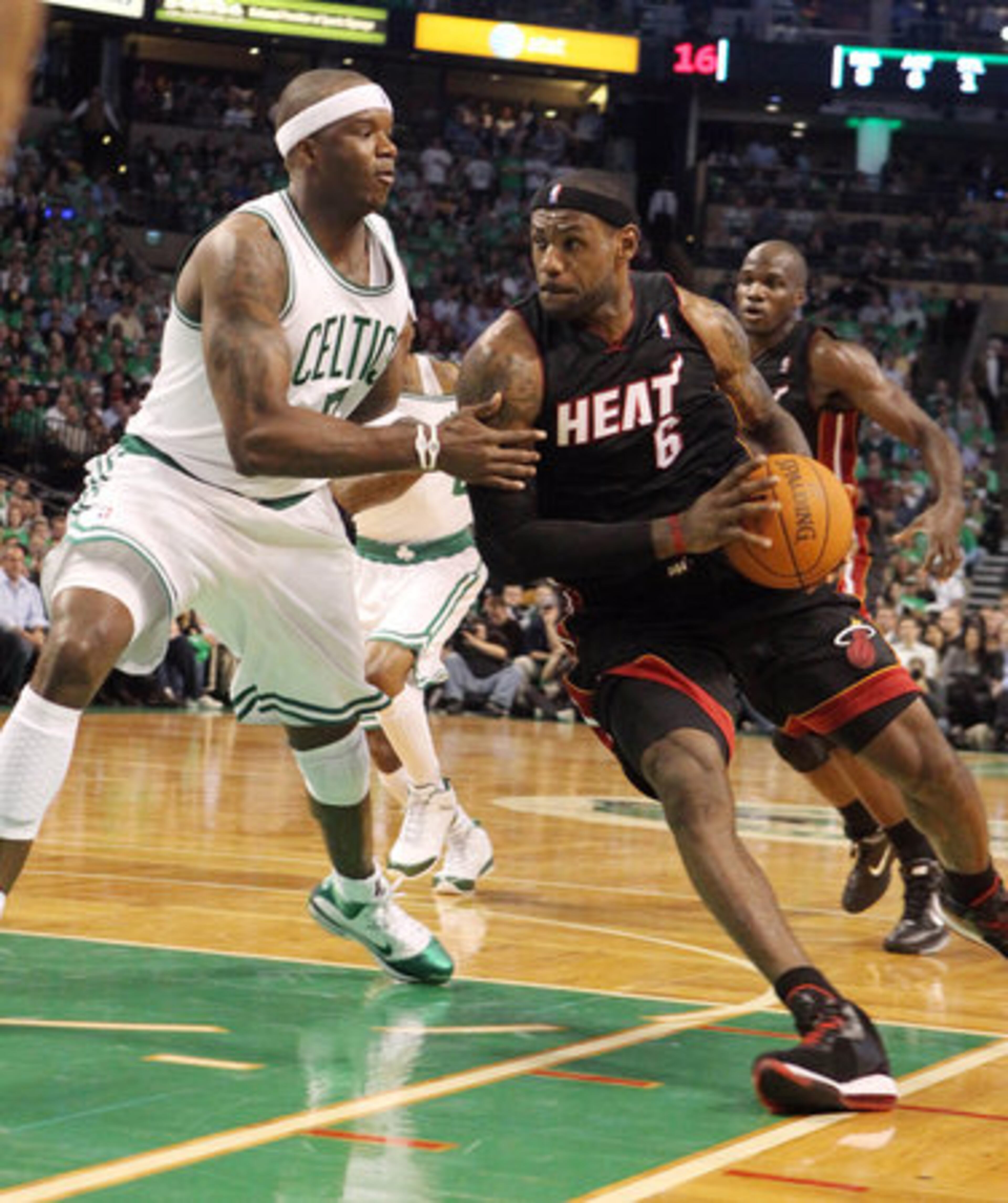 Jermaine O'Neal tries to stop James as he drives to the basket.