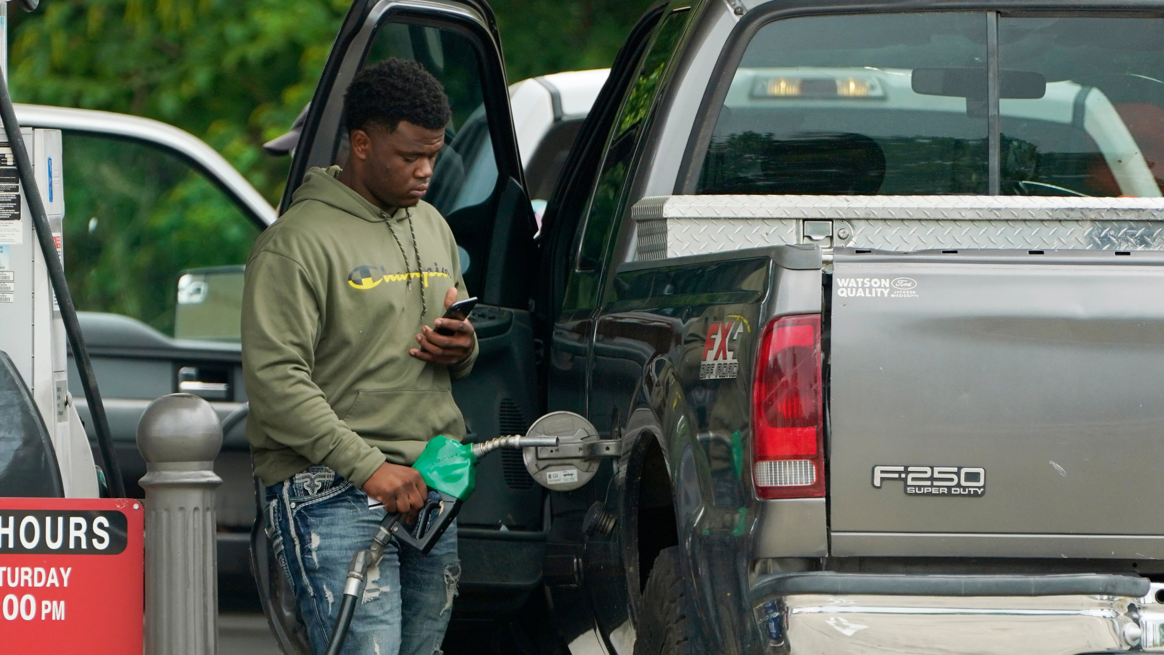 FILE - A customer prepares to pump diesel fuel at this Madison, Miss., Sam's Club, Tuesday, May 24, 2022. (AP Photo/Rogelio V. Solis, File)
