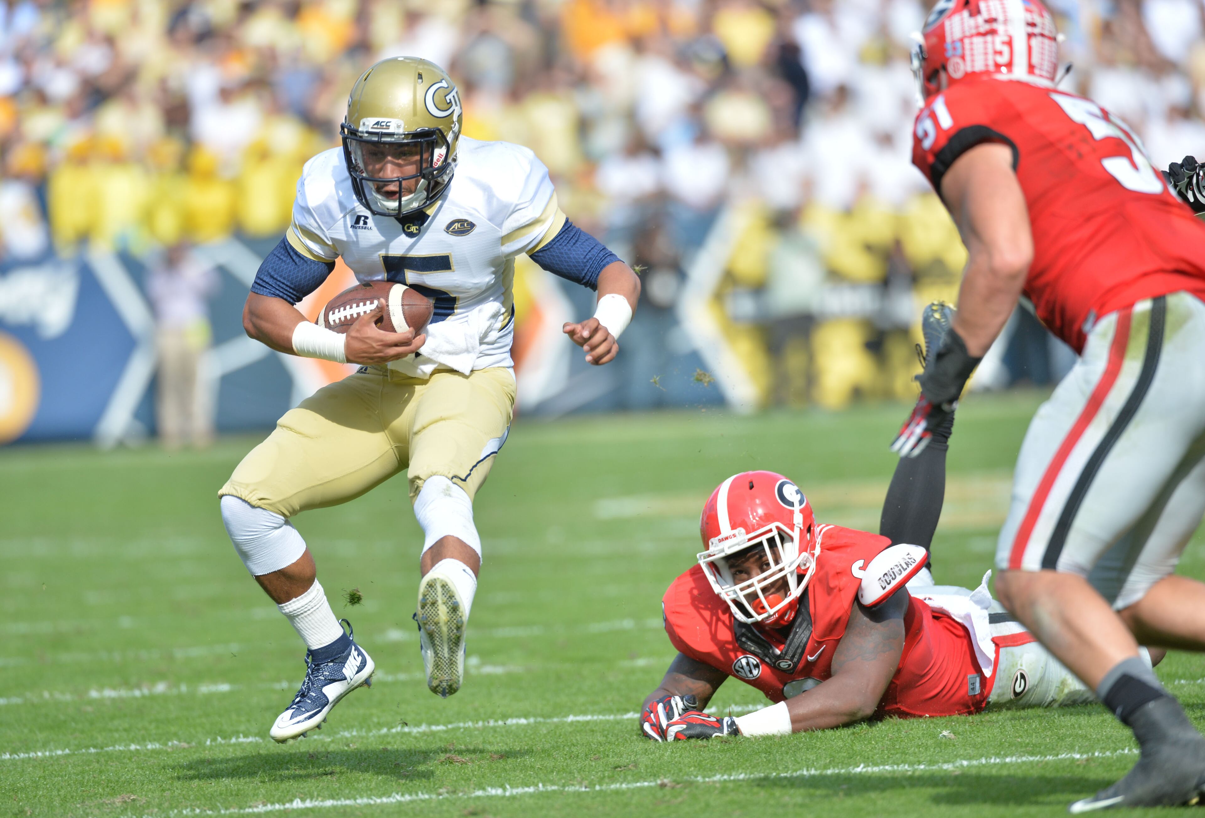 November 28, 2015 Atlanta - Georgia Tech Yellow Jackets quarterback Justin Thomas (5) makes a move in the first half at Bobby Dodd Stadium on Saturday, November 28, 2015. HYOSUB SHIN / HSHIN@AJC.COM