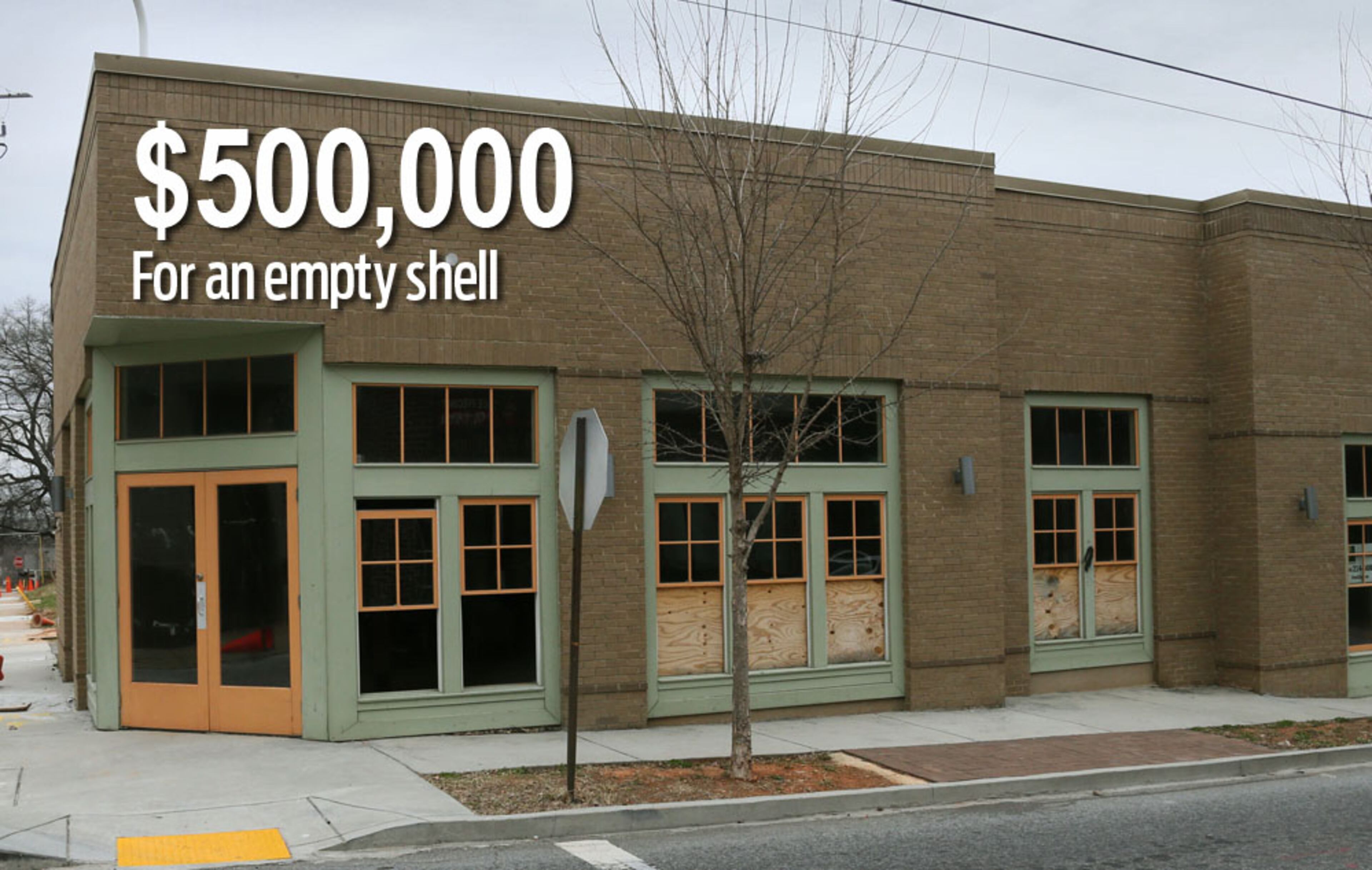 Atlanta’s development authority gave funds to construct this retail building, but none to complete its interior. No businesses moved in when it was completed in 2011, and vandals struck last year when police moved out of a station across the street. BOB ANDRES / BANDRES@AJC.COM