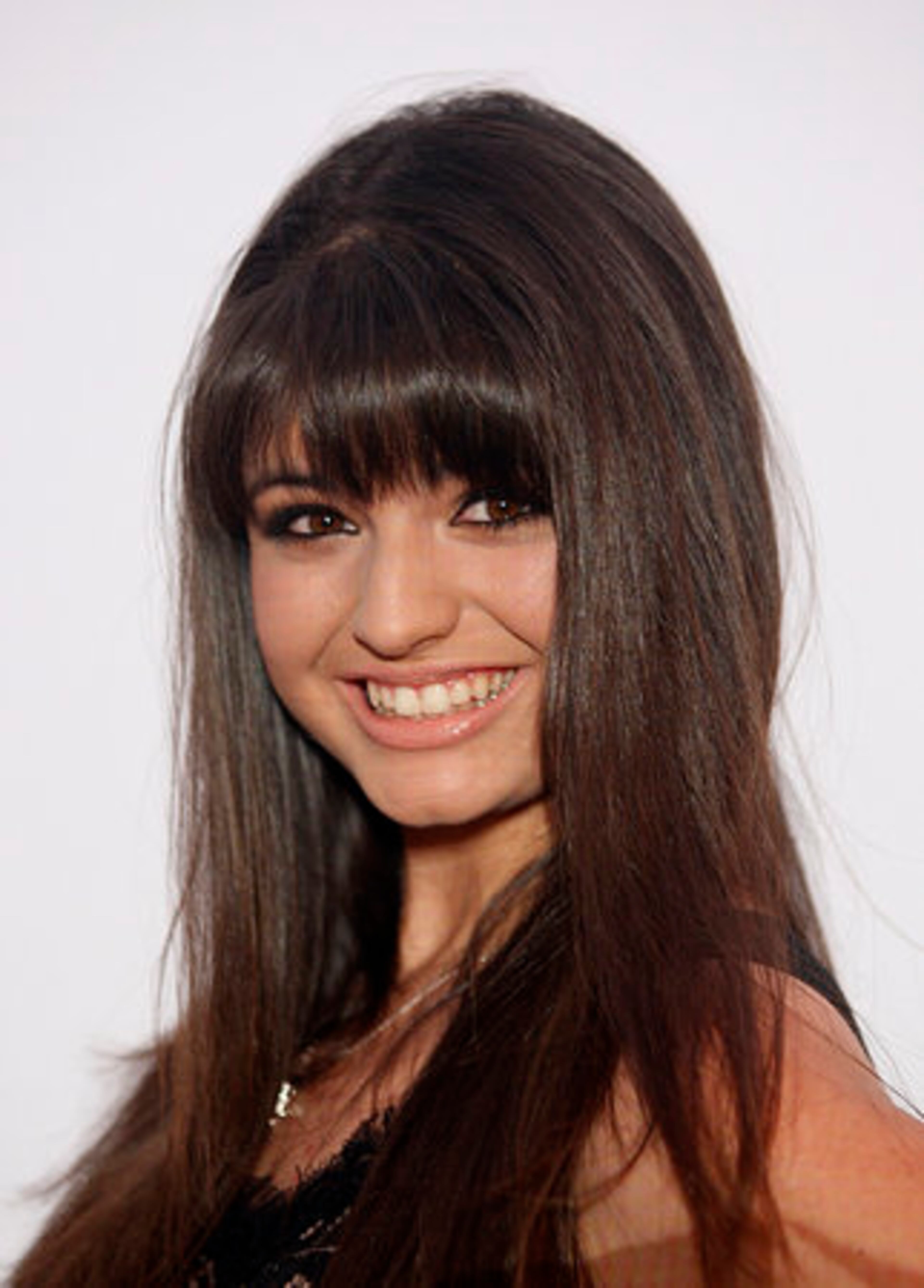Rebecca Black poses during her arrival.