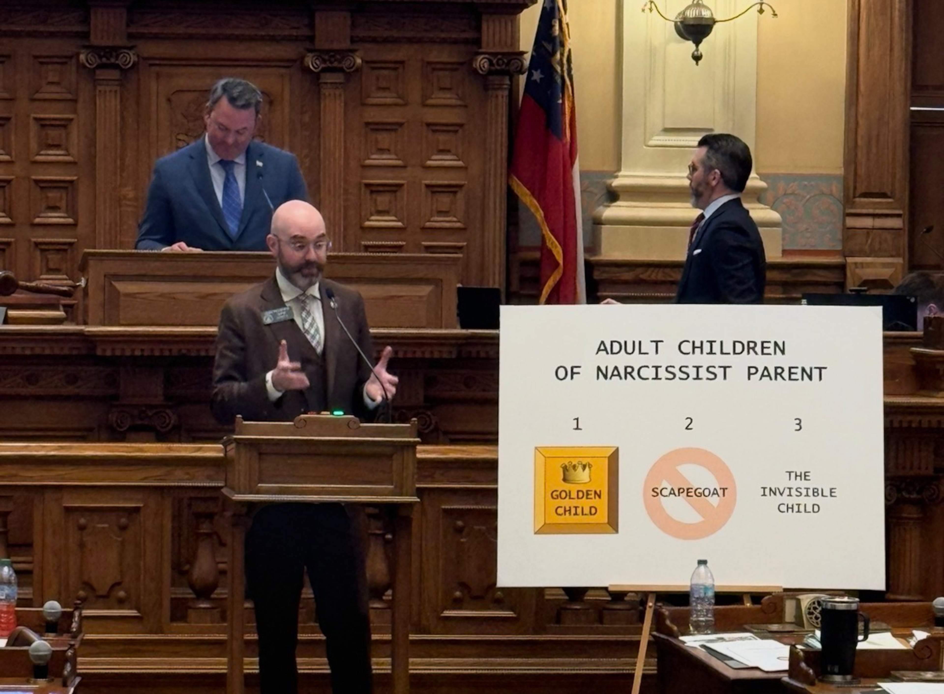 State Sen. Josh McLaurin compares Senate Republicans to enablers of a "narcissist" President Donald Trump on Monday, Feb. 2, 2026 as Lt. Gov. Burt Jones looks on. (Greg Bluestein/AJC)