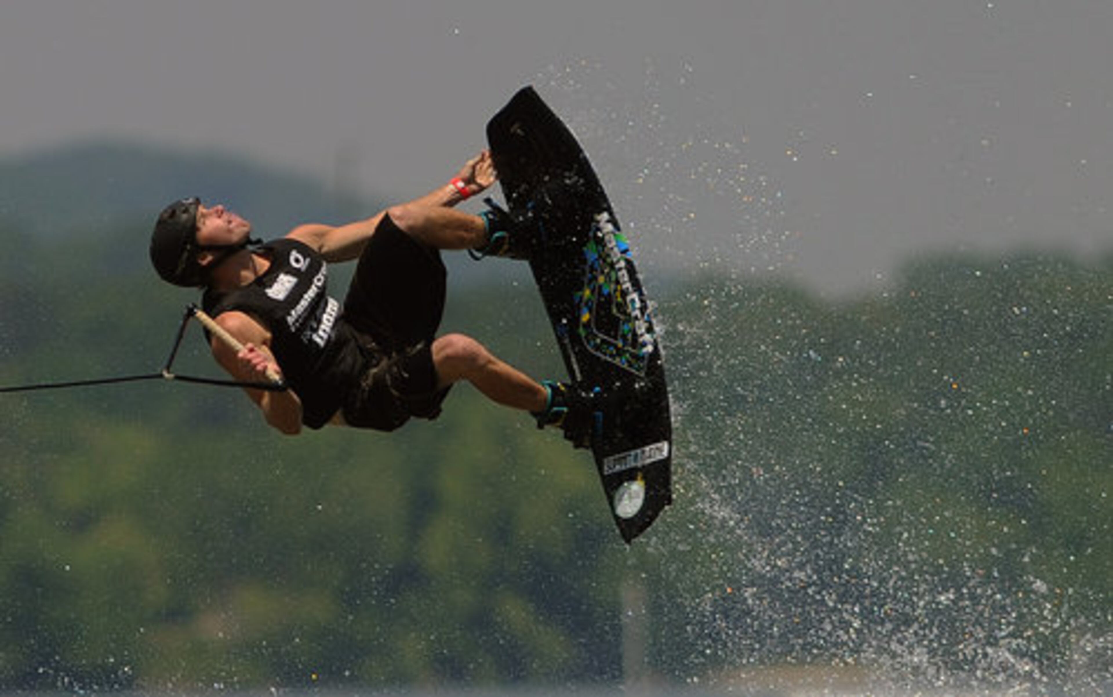 Andrew Adkison goes into his first spin during the MasterCraft Pro Wakeboard Tour event.