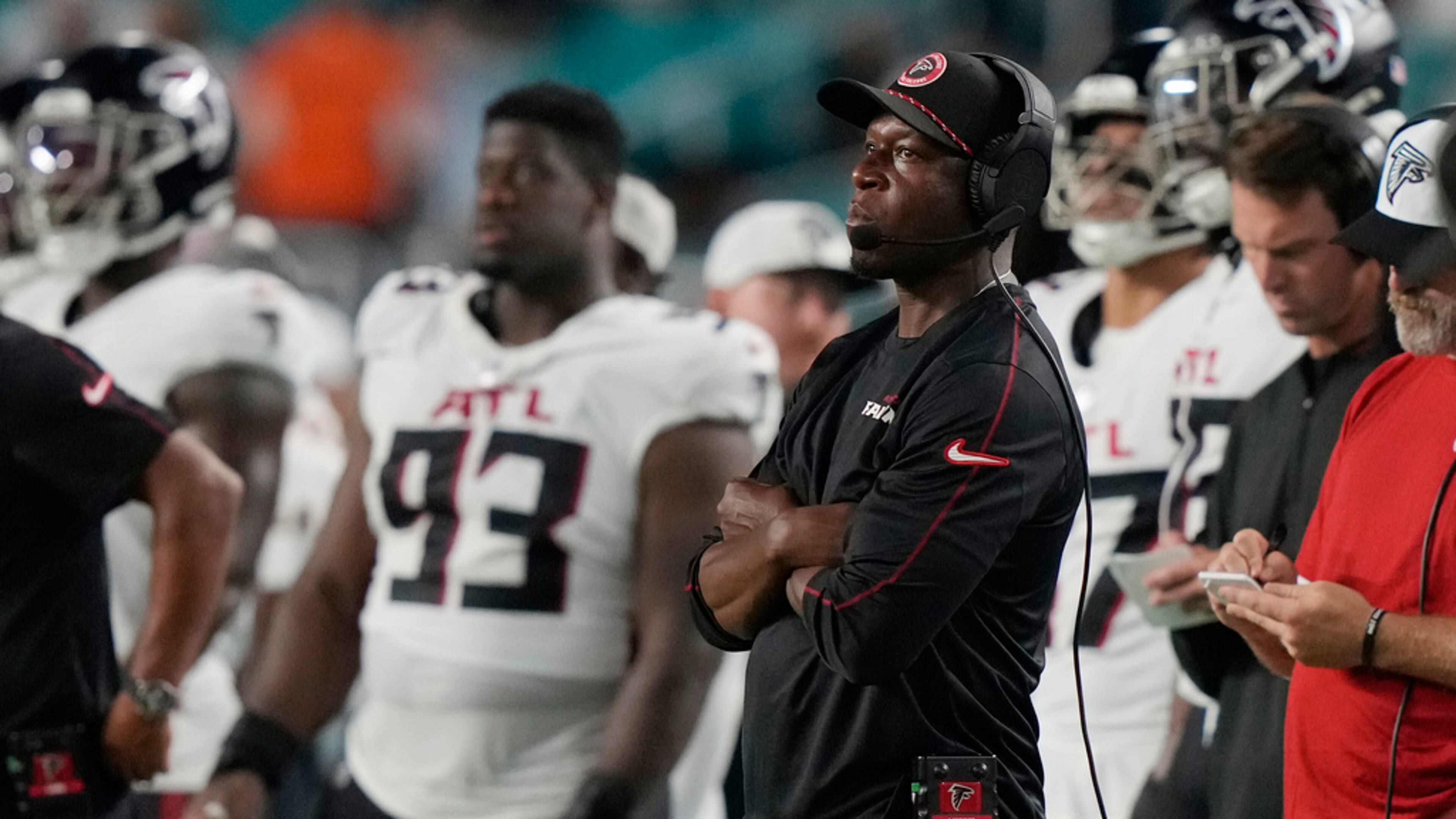 Atlanta Falcons head coach Raheem Morris watches the game from the sidelines during the first half of a pre season NFL football game against the Miami Dolphins, Friday, Aug. 9, 2024, in Miami Gardens, Fla. (AP Photo/Lynne Sladky)