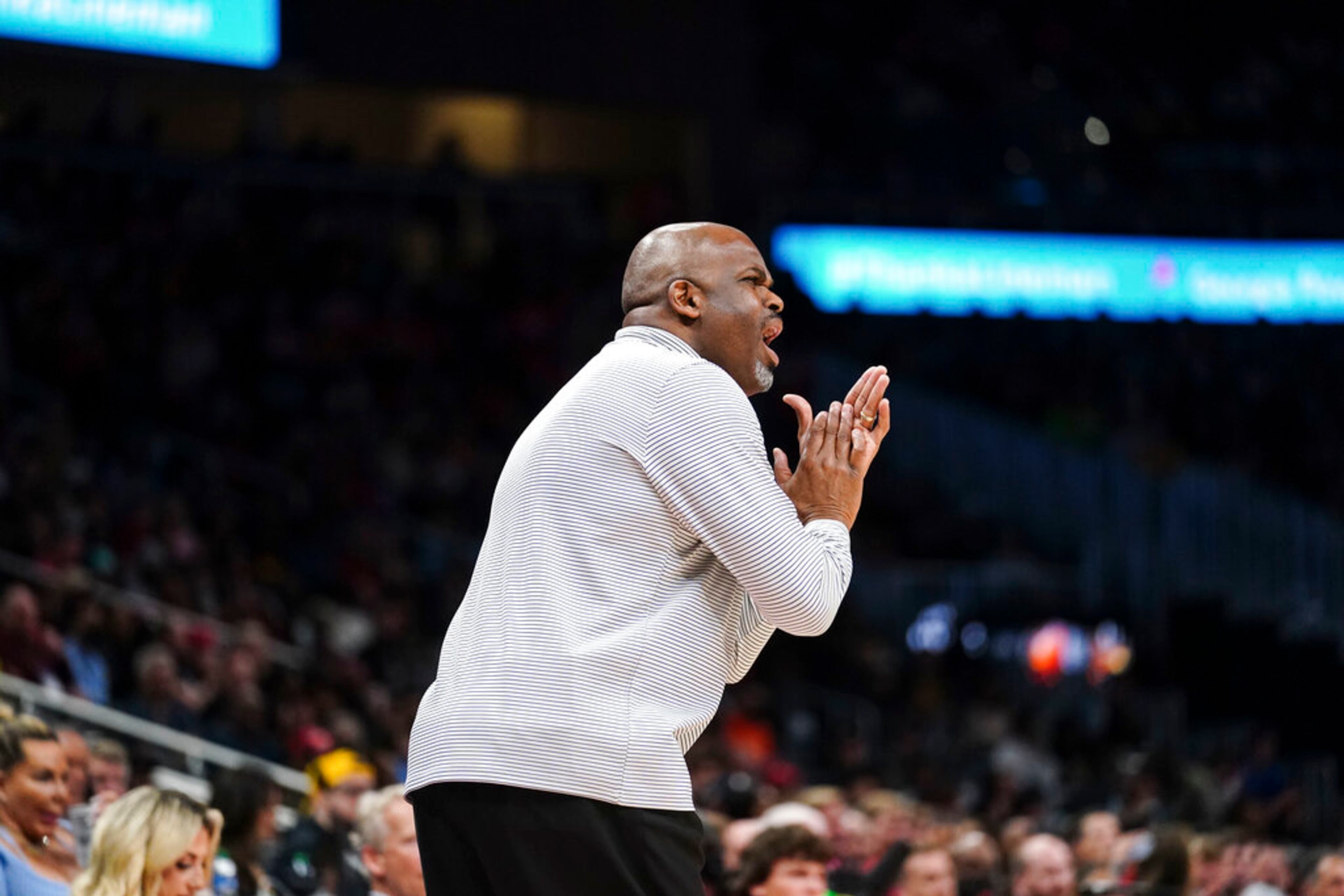 Atlanta Hawks coach Nate McMillan encourages players during the first half of the team's NBA basketball game against the Washington Wizards on Wednesday, April 6, 2022, in Atlanta. (AP Photo/John Bazemore)