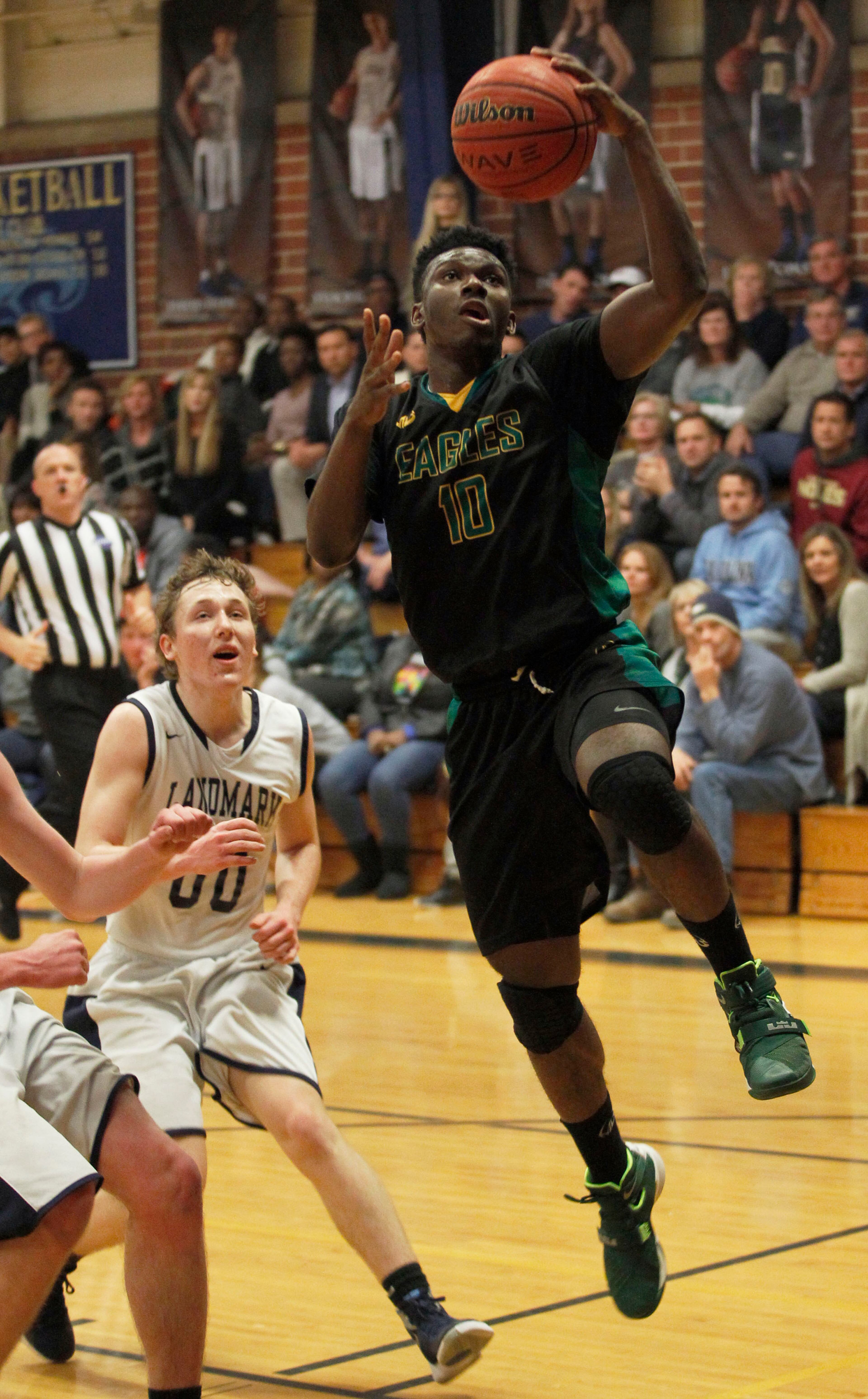 Greenforest Christian guard John Ogwuche (10) shoots a layup against Landmark Christian Collier Schultz (00) at a high school basketball game at Landmark Christian school Friday, February 5, 2016. TAMI CHAPPELL/SPECIAL TO THE AJC