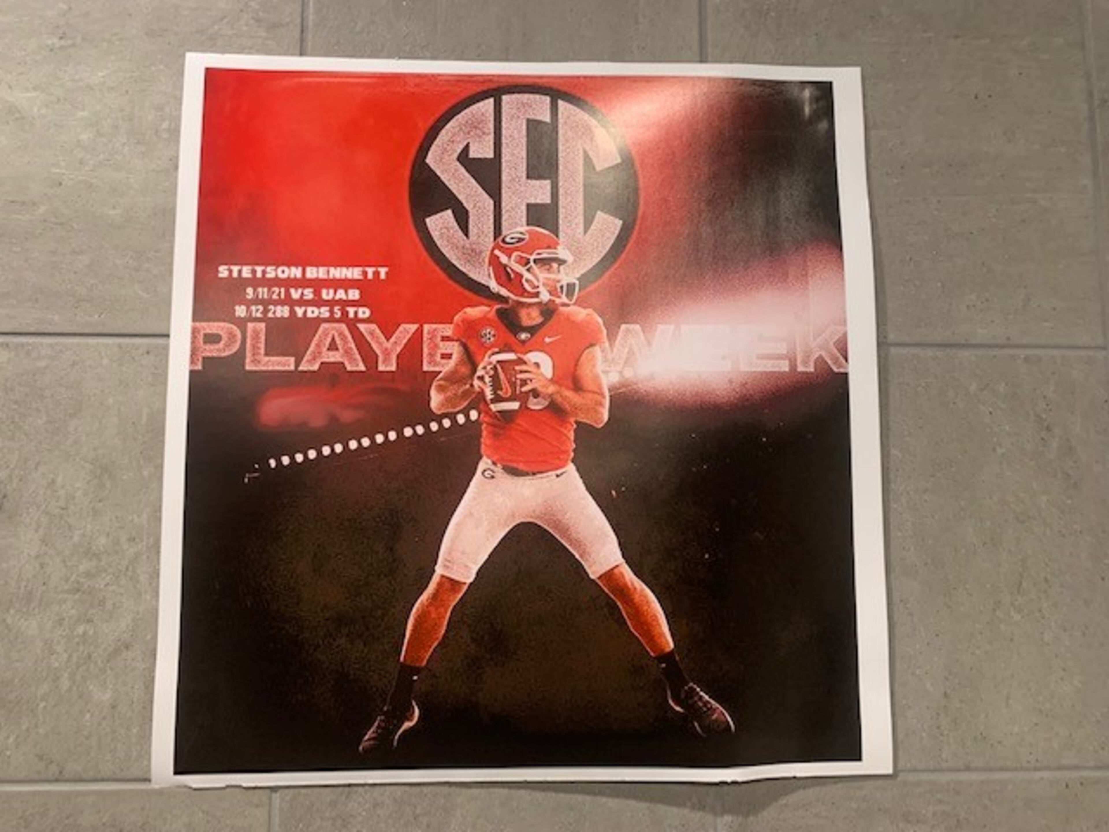 A poster from the Georgia-UAB game is displayed on wall inside Pierce High School training room.