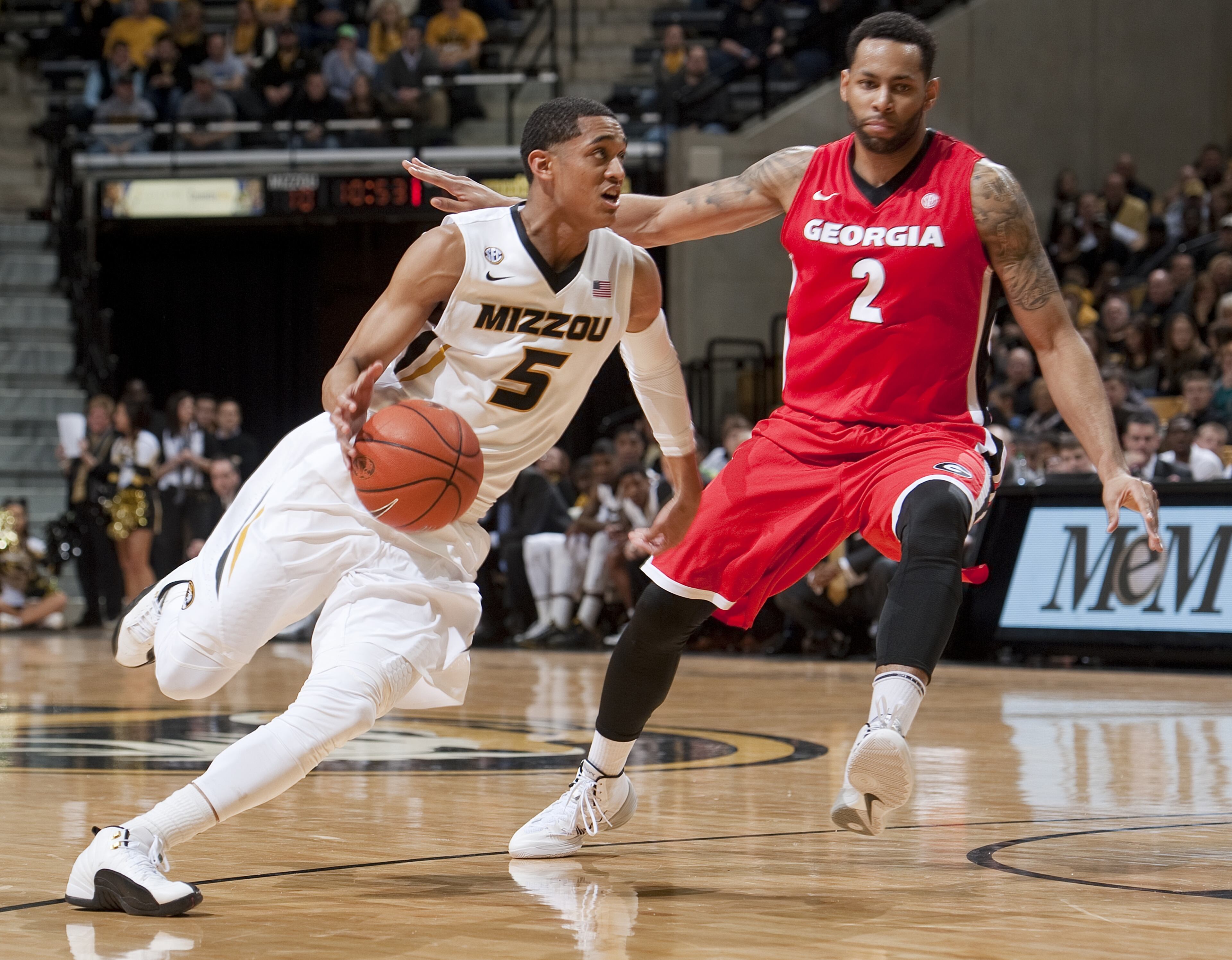 Missouri's Jordan Clarkson, left, dribbles past Georgia's Marcus Thornton, right, during the first half of an NCAA college basketball game Wednesday, Jan. 8, 2014, in Columbia, Mo. Georgia won the game 70-64. (AP Photo/L.G. Patterson)