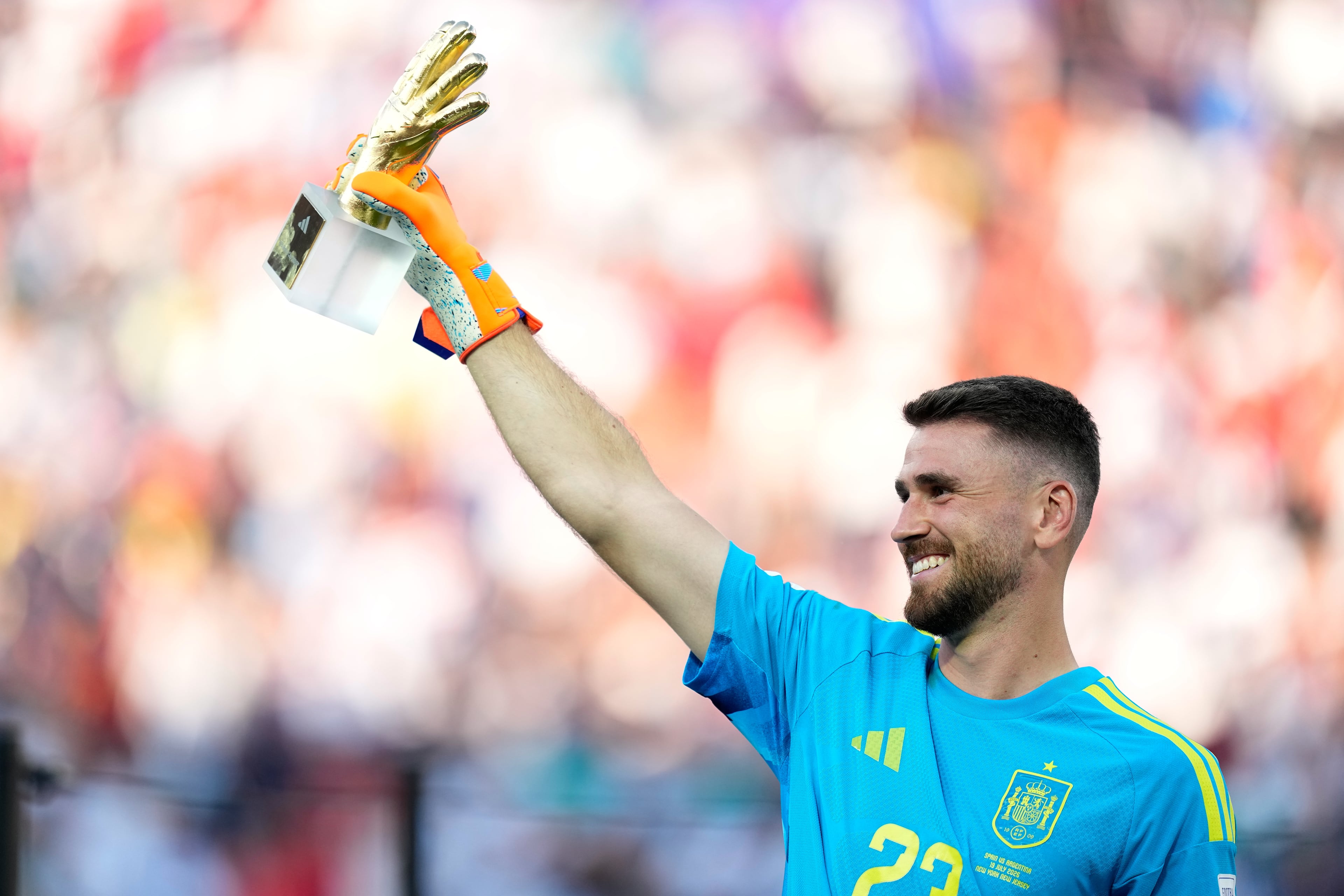 Spain goalkeeper Unai Simon poses with the tournament's best goalkeeper award at the end of the World Cup final soccer match between Spain and Argentina in East Rutherford, N.J., near New York, Sunday, July 19, 2026. (Ashley Landis/AP)